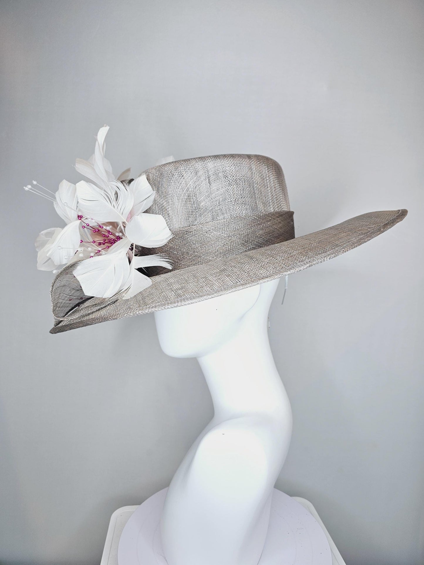 kentucky derby hat large wide brim sinamay gray hat with large white champagne pink silk flower and white branching feathers