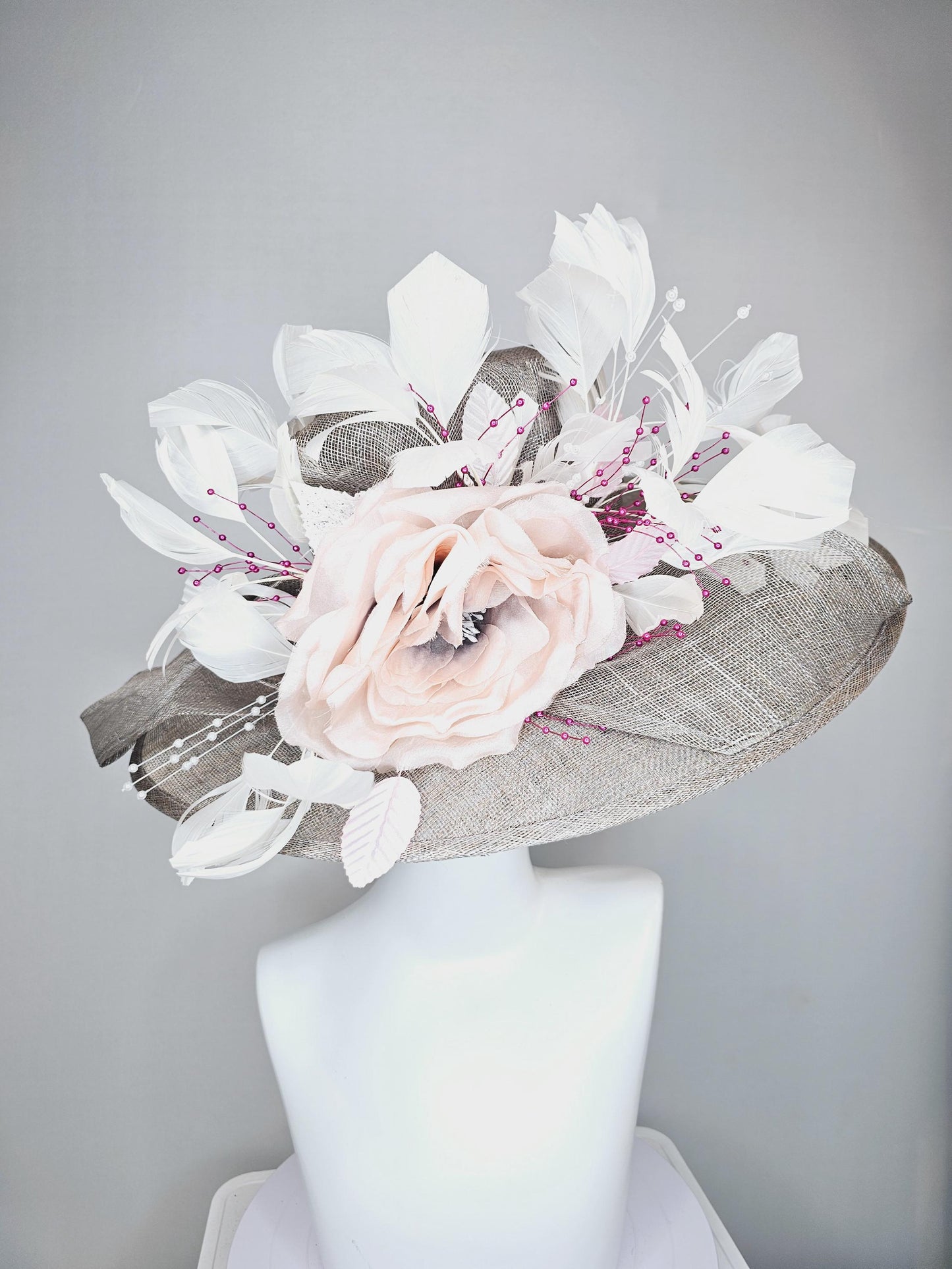 kentucky derby hat large wide brim sinamay gray hat with large white champagne pink silk flower and white branching feathers