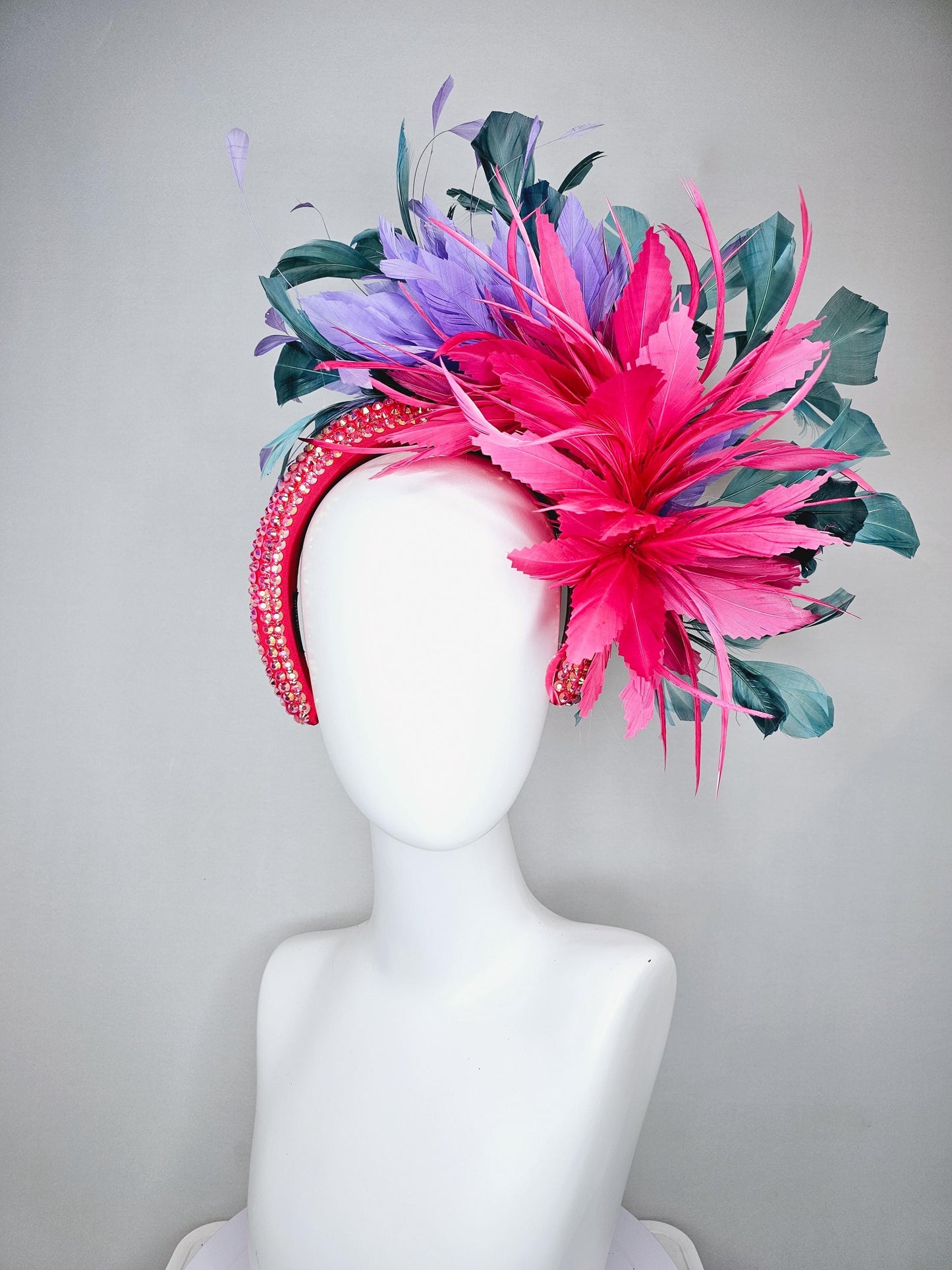 kentucky derby hat fascinator branching hot pink,blue teal,and purple feathers on iridescent Swarovski crystal coral pink headband