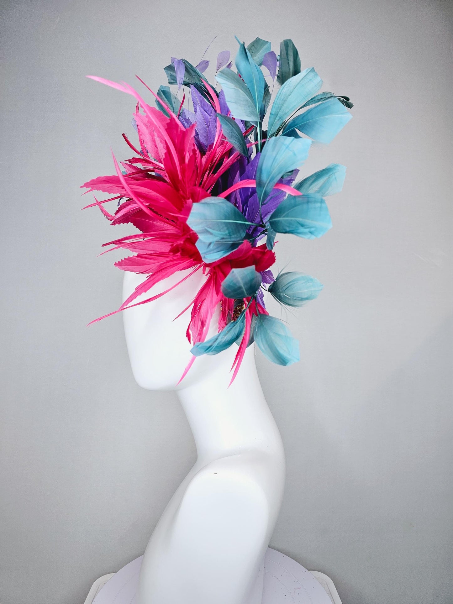 kentucky derby hat fascinator branching hot pink,blue teal,and purple feathers on iridescent Swarovski crystal coral pink headband
