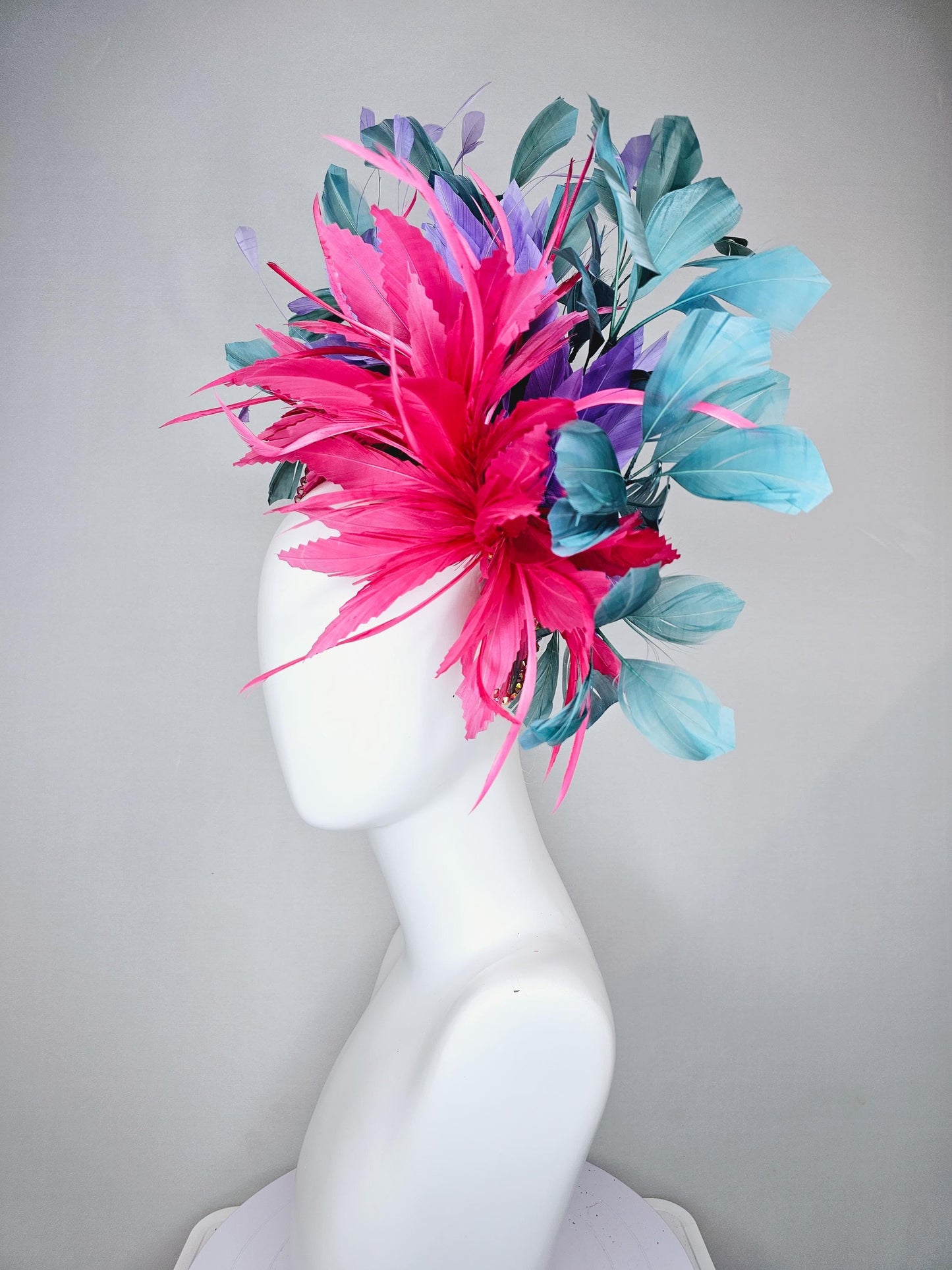 kentucky derby hat fascinator branching hot pink,blue teal,and purple feathers on iridescent Swarovski crystal coral pink headband