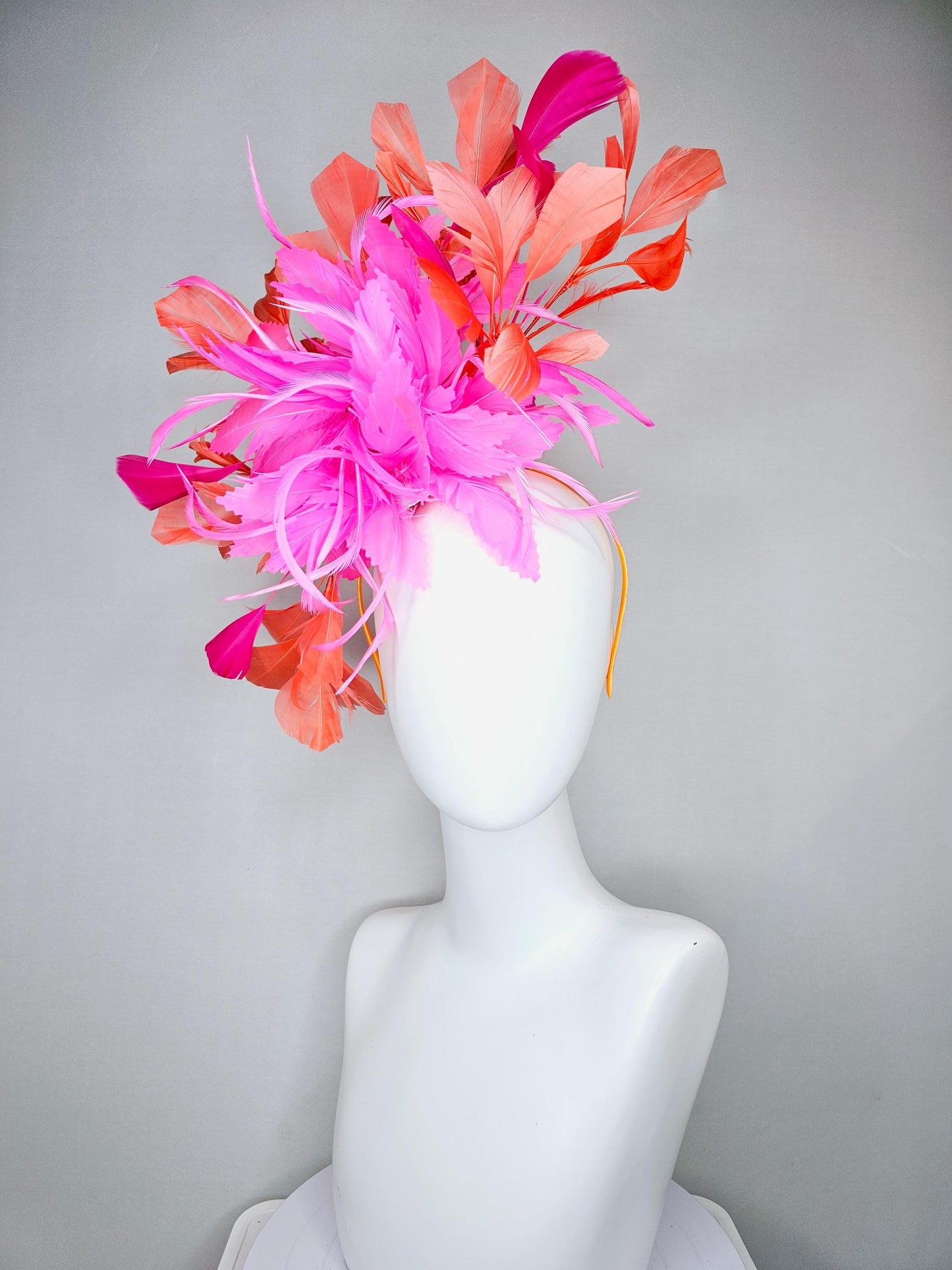 kentucky derby hat fascinator with bright pink feather flowers, fuchsia pink and orange coral branching feathers