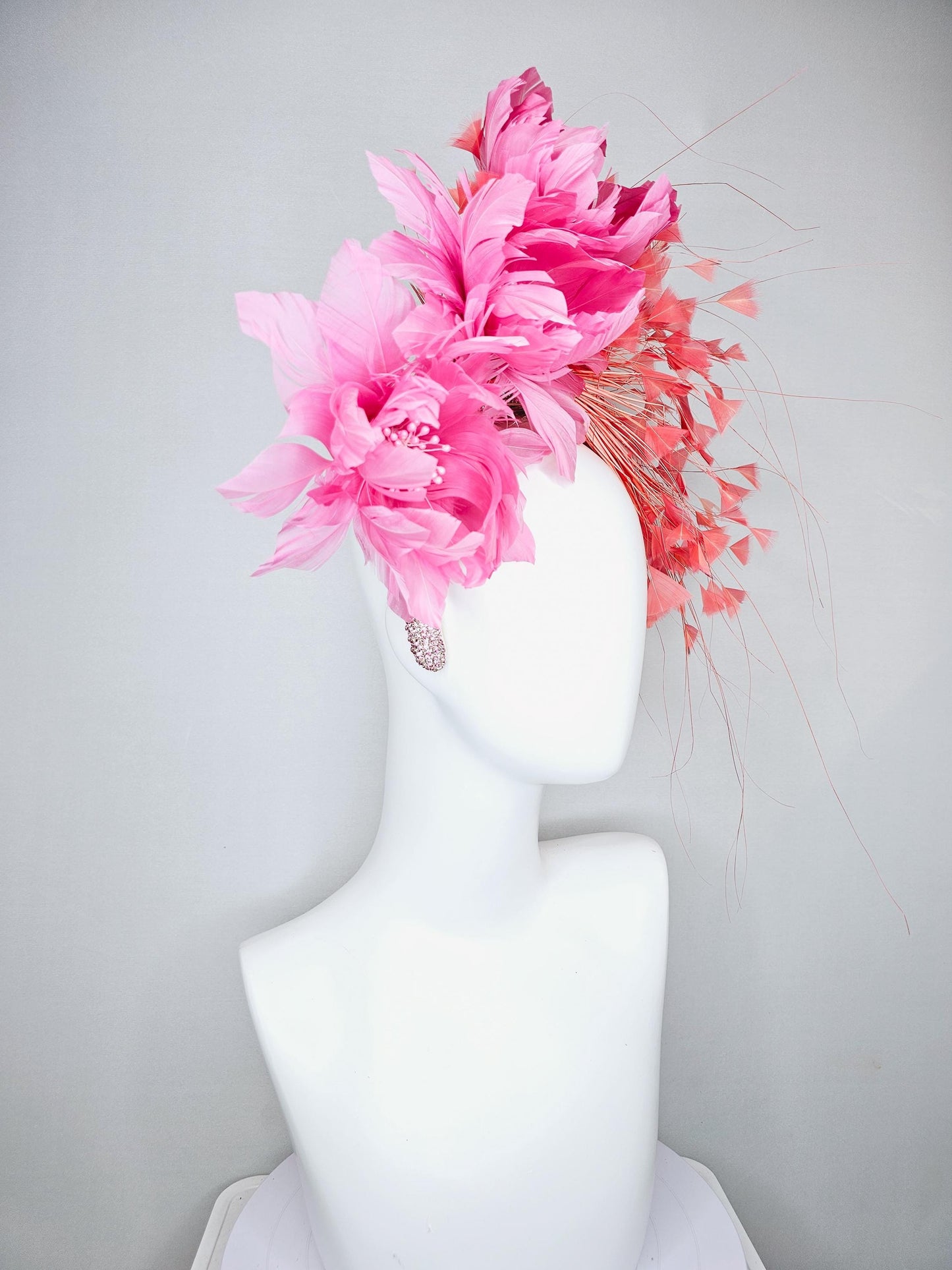 kentucky derby hat fascinator with rose pink feather flowers, light orange coral branching feathers, light pink crystal rhinestone headband