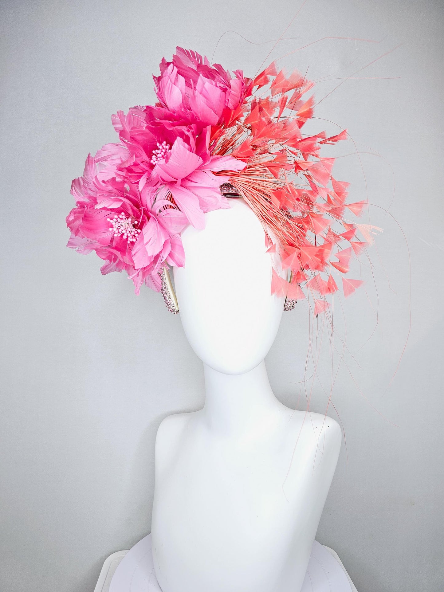 kentucky derby hat fascinator with rose pink feather flowers, light orange coral branching feathers, light pink crystal rhinestone headband