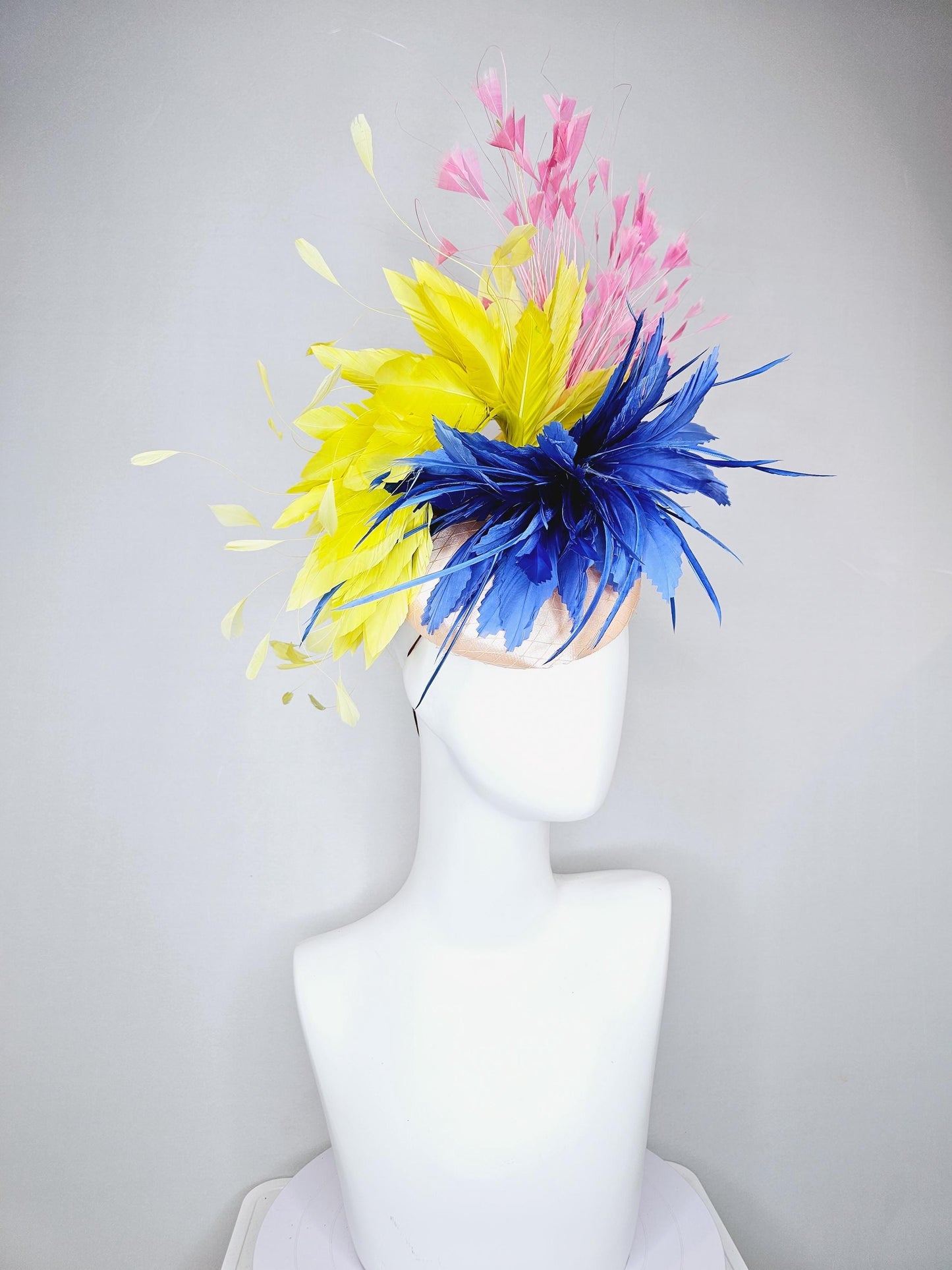 kentucky derby hat fascinator champagne satin with netting,cobalt royal blue and yellow feather flower, light blush pink branching feathers