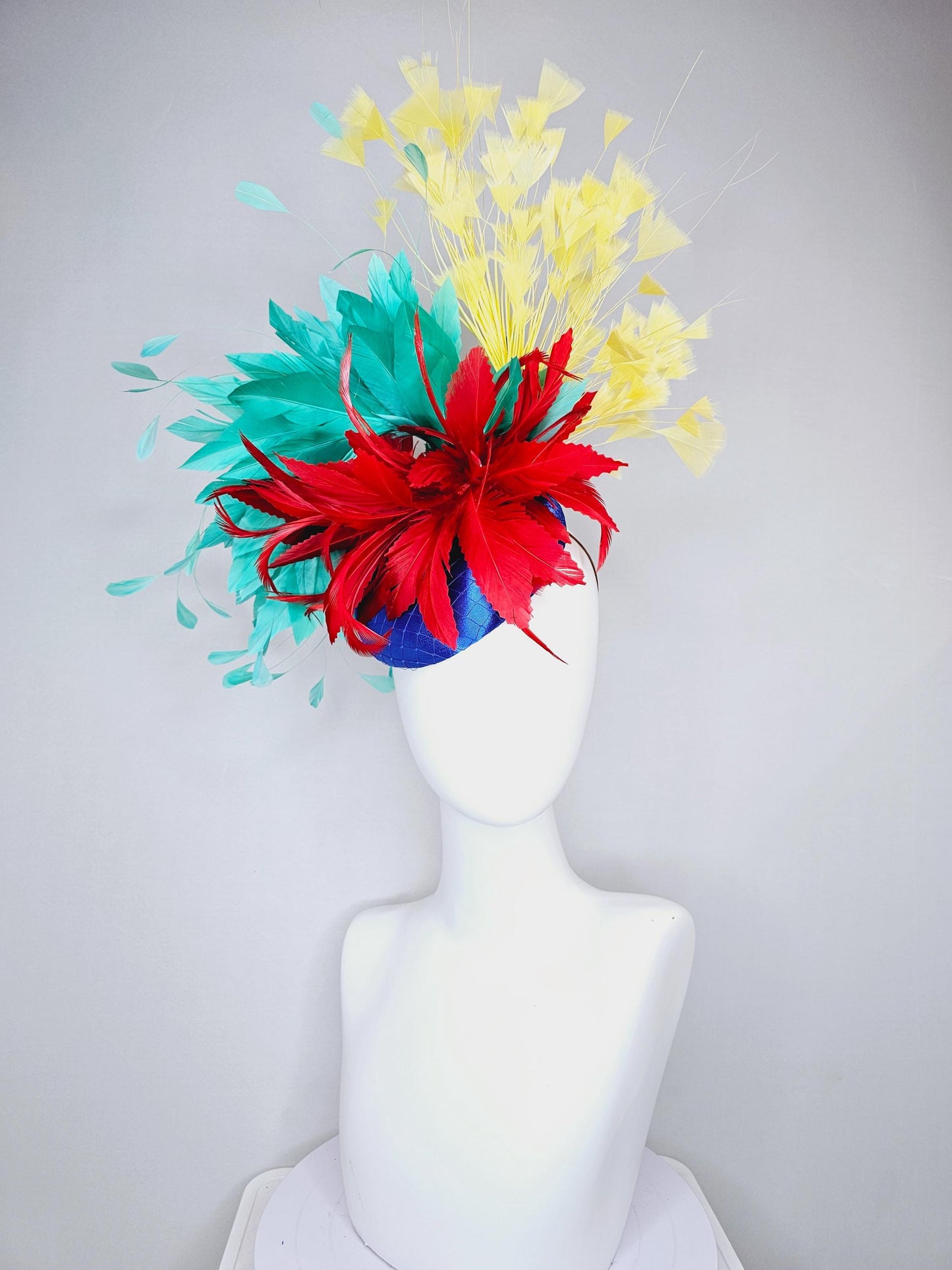 kentucky derby fascinator cobalt royal blue satin with netting,red and turquoise aqua blue feather flower,yellow branching feathers