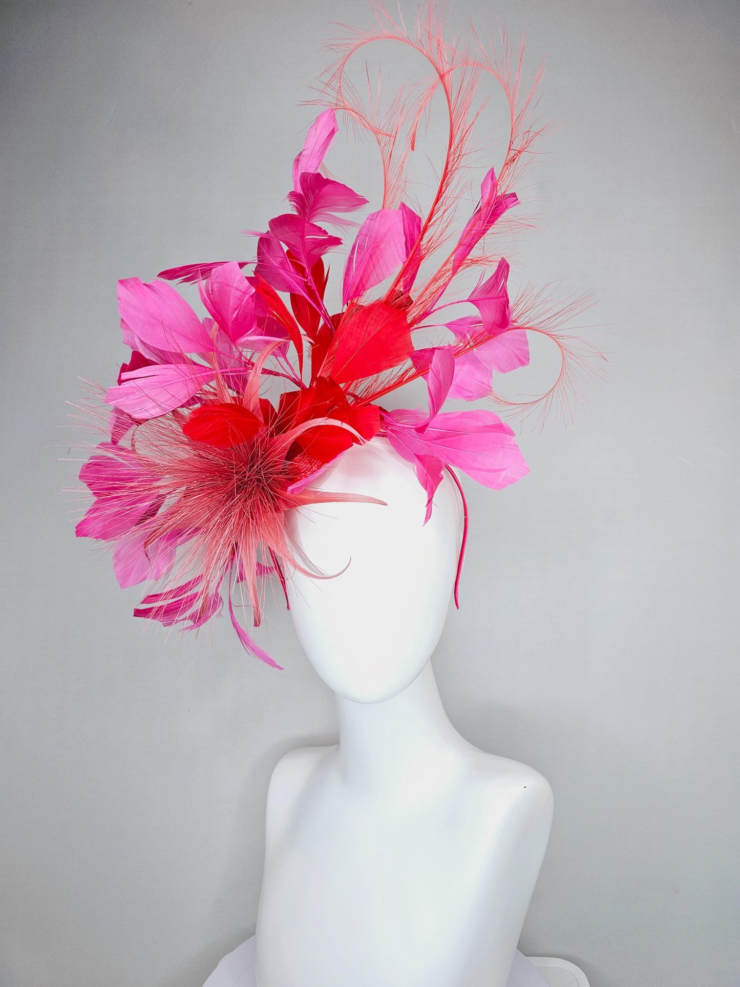 kentucky derby hat fascinator light red spiky feather flower, cherry scarlet red and pink branching feathers and light red feather curls