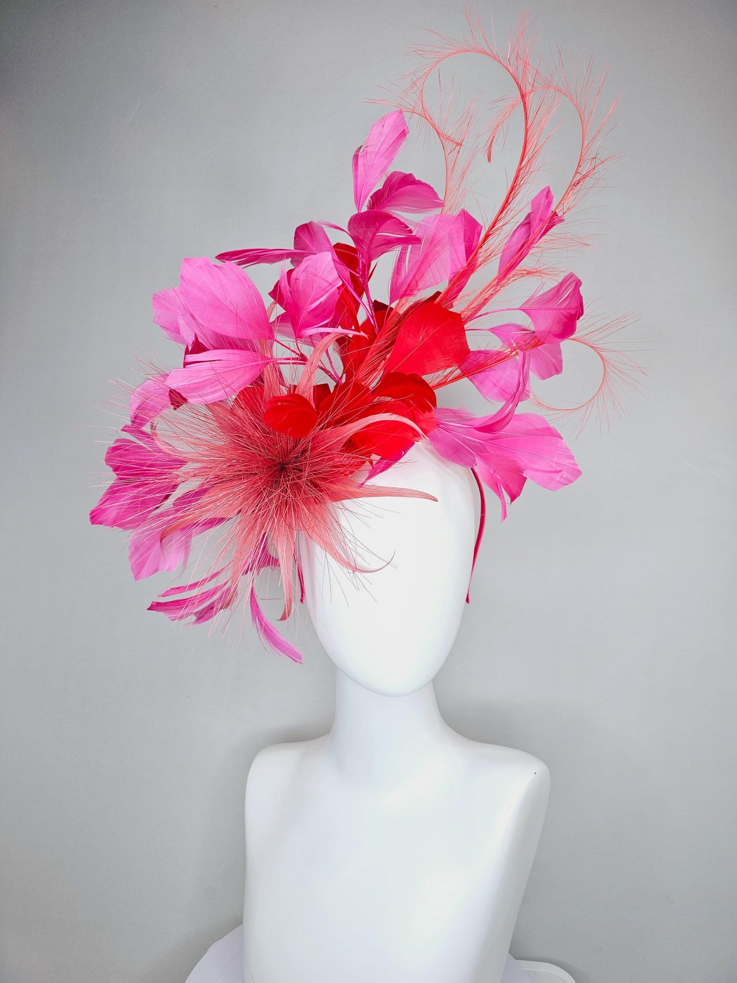 kentucky derby hat fascinator light red spiky feather flower, cherry scarlet red and pink branching feathers and light red feather curls
