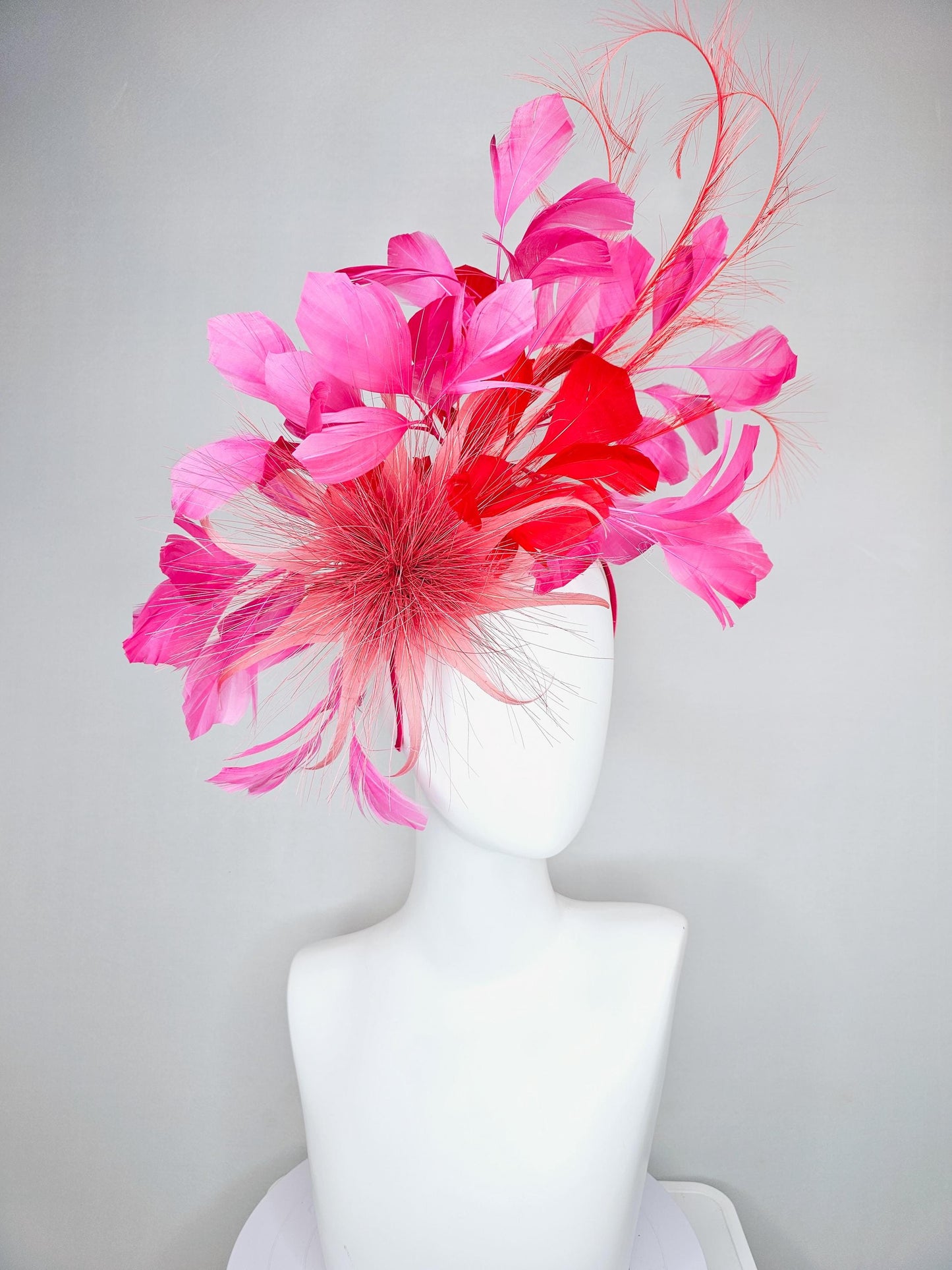 kentucky derby hat fascinator light red spiky feather flower, cherry scarlet red and pink branching feathers and light red feather curls