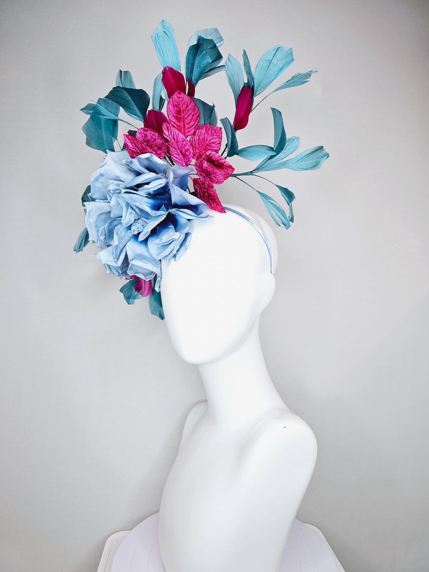 kentucky derby hat fascinator baby blue satin silk flower with fuchsia pink satin leaves and teal blue branching feathers, thin headband