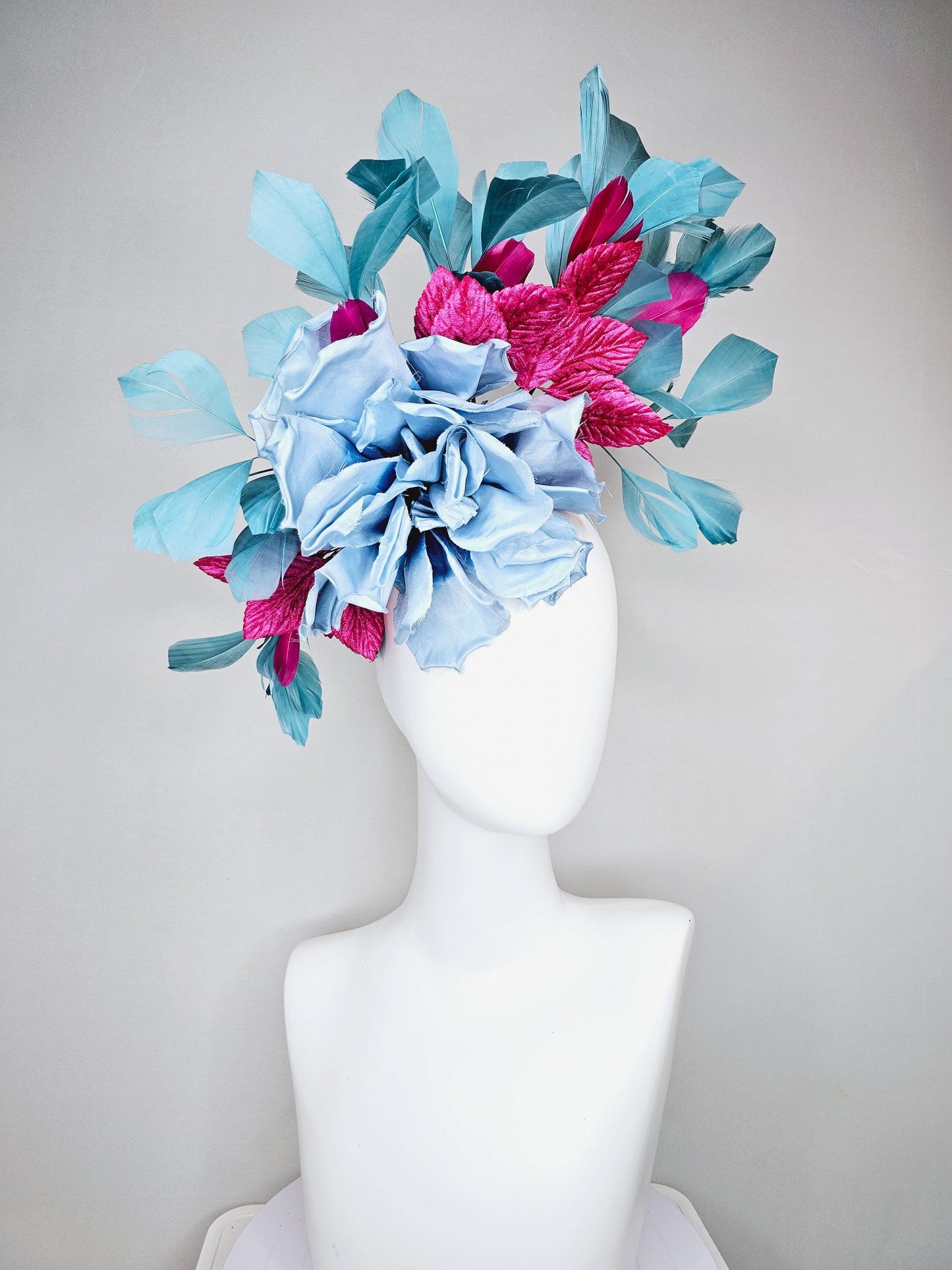 kentucky derby hat fascinator baby blue satin silk flower with fuchsia pink satin leaves and teal blue branching feathers, thin headband