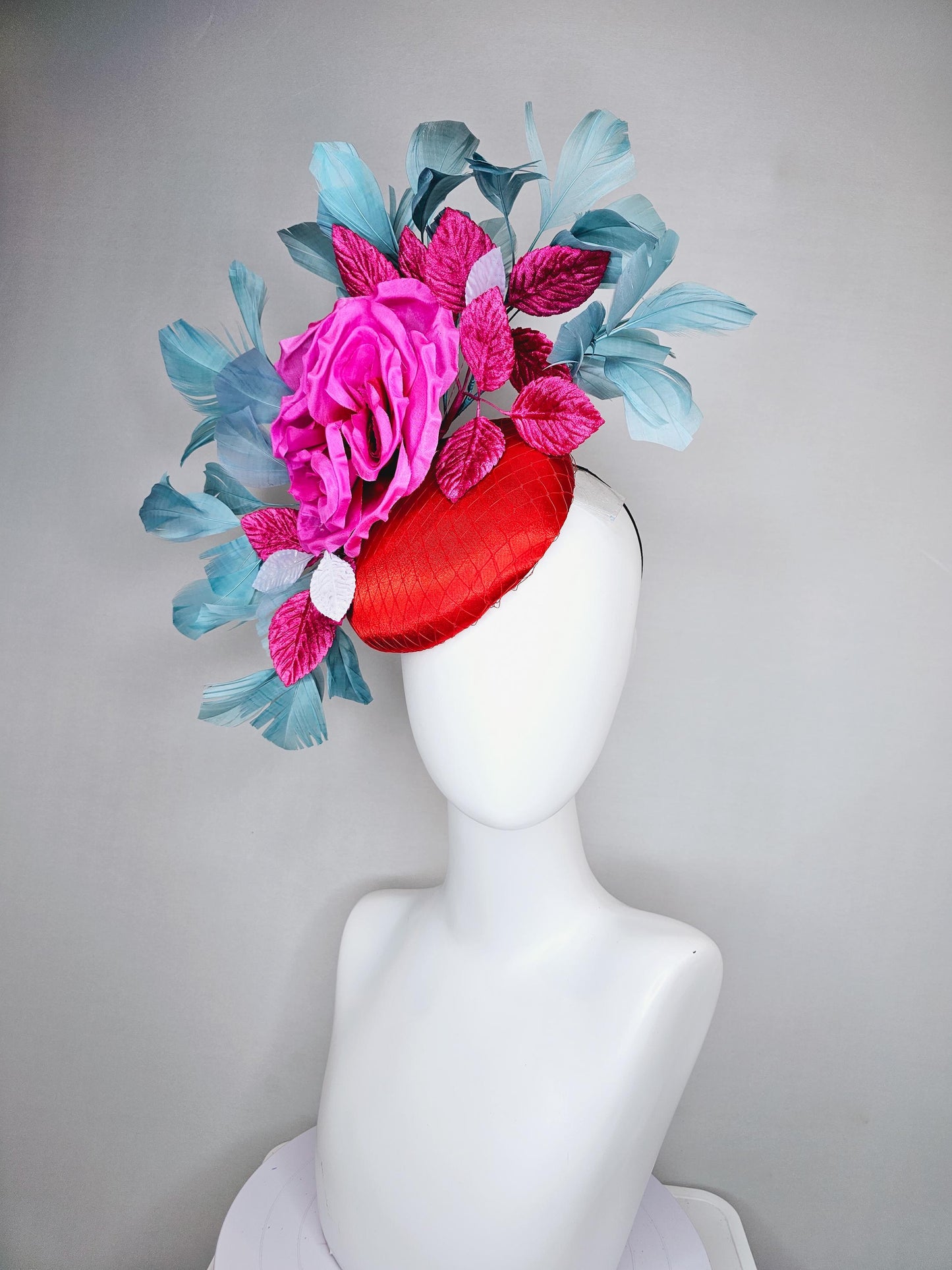kentucky derby hat fascinator red satin with netting bright pink satin silk flower with pink and white leaves teal blue branching feathers