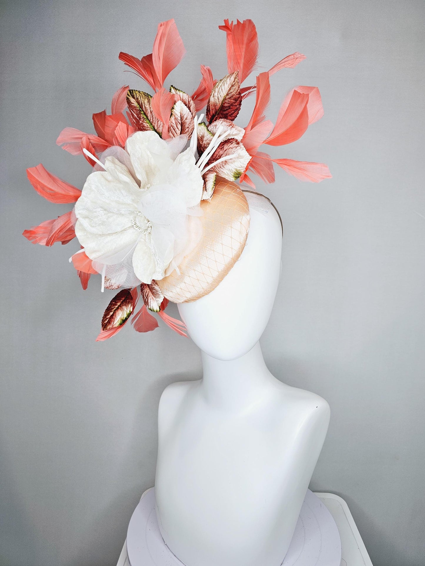 kentucky derby hat fascinator neutral beige satin with netting, white organza flowers, orange ombre leaves, orange peach branching feathers