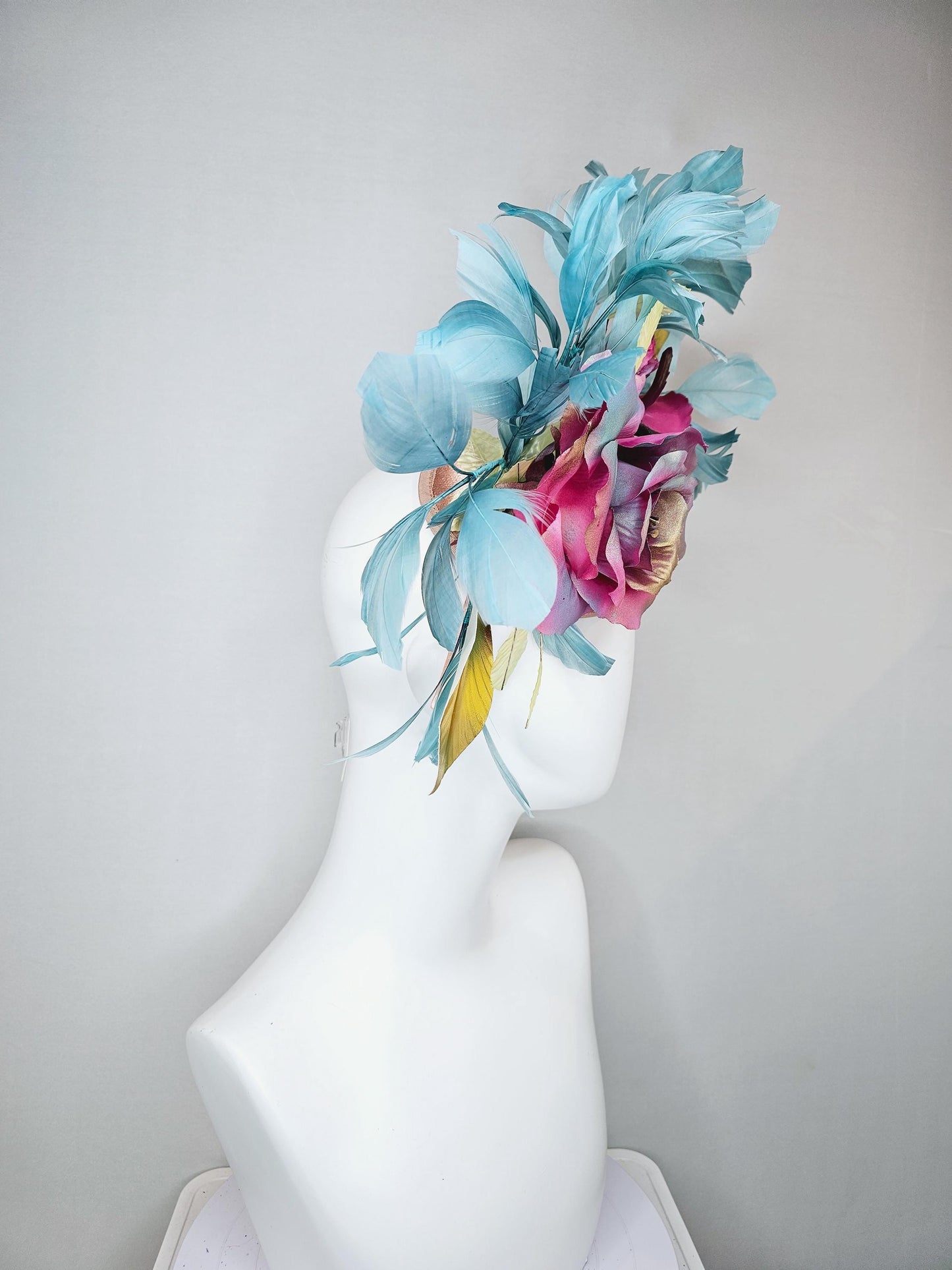 kentucky derby hat fascinator champagne satin with rainbow pink gold teal blue rose flowers and gold leaves, teal blue feathers
