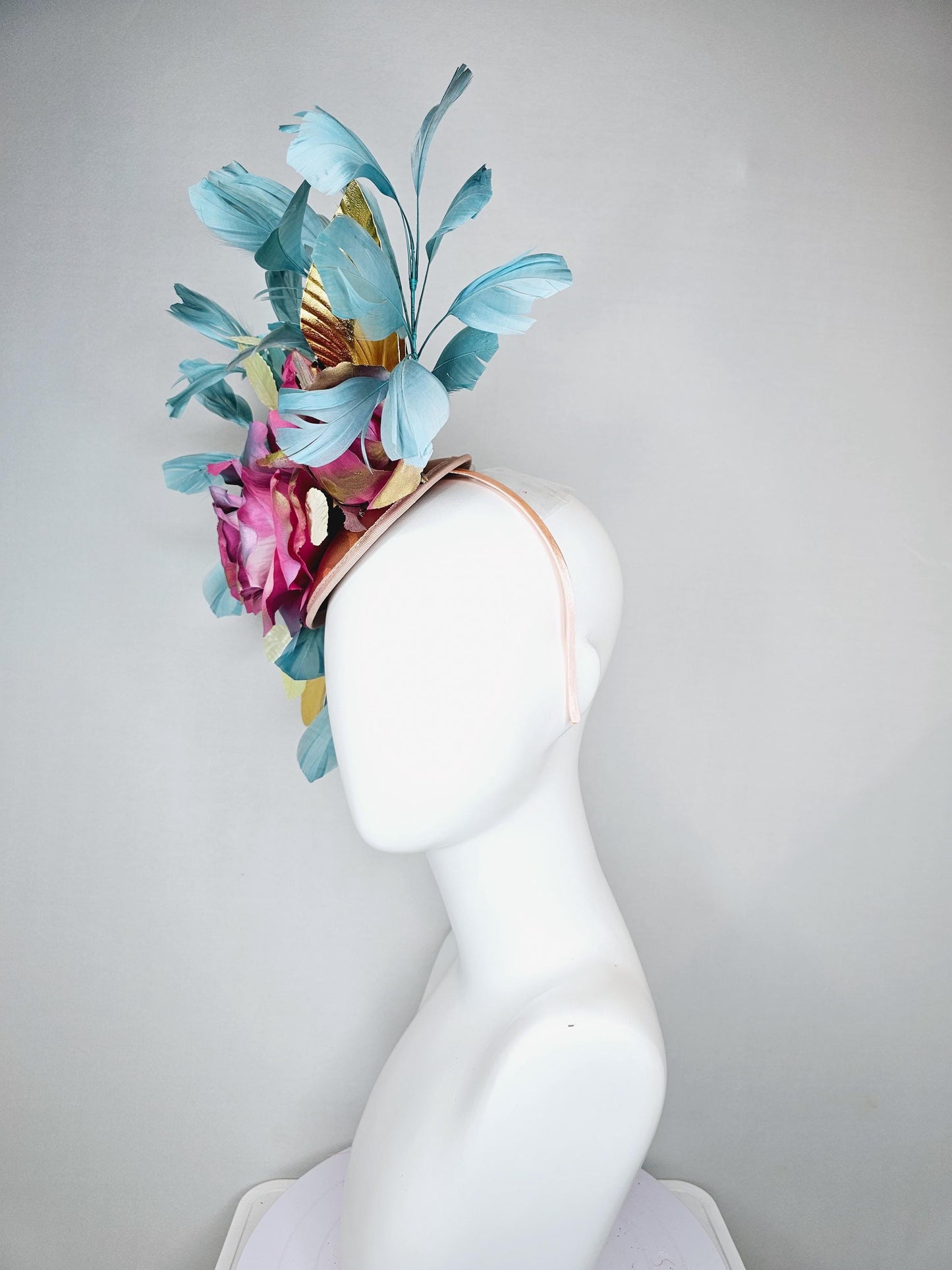 kentucky derby hat fascinator champagne satin with rainbow pink gold teal blue rose flowers and gold leaves, teal blue feathers