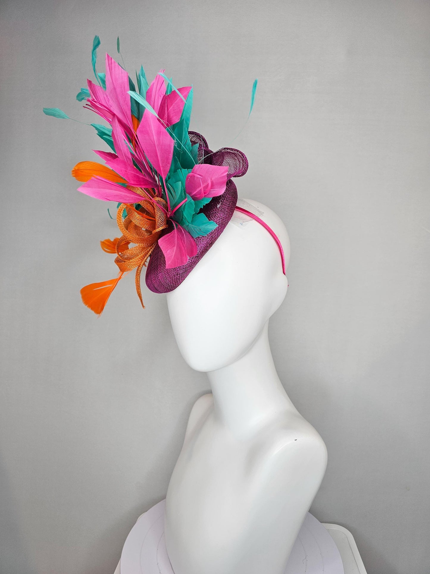 kentucky derby hat fascinator magenta purple sinamay with orange sinamay bow and orange feathers,pink and aqua blue green branching feathers