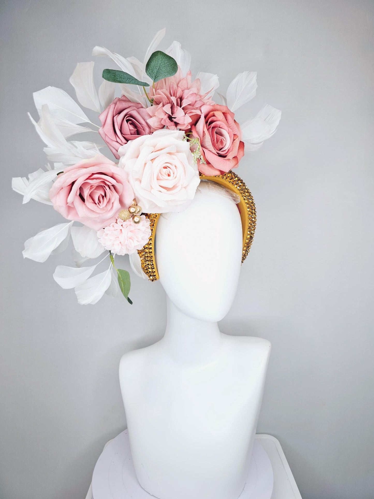 kentucky derby hat fascinator gold crystal headband, light pink dusty pink satin flowers, green leaves, ivory white feathers