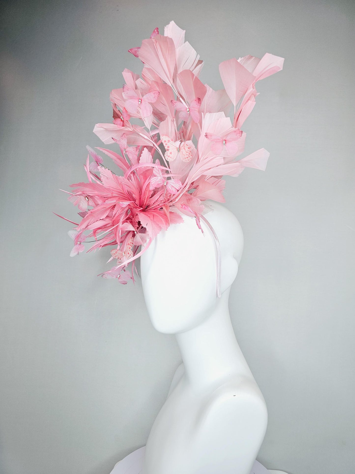 kentucky derby hat fascinator with fluffy light blush pink zigzag feather, light blush pink branching feathers, light blush pink butterflies
