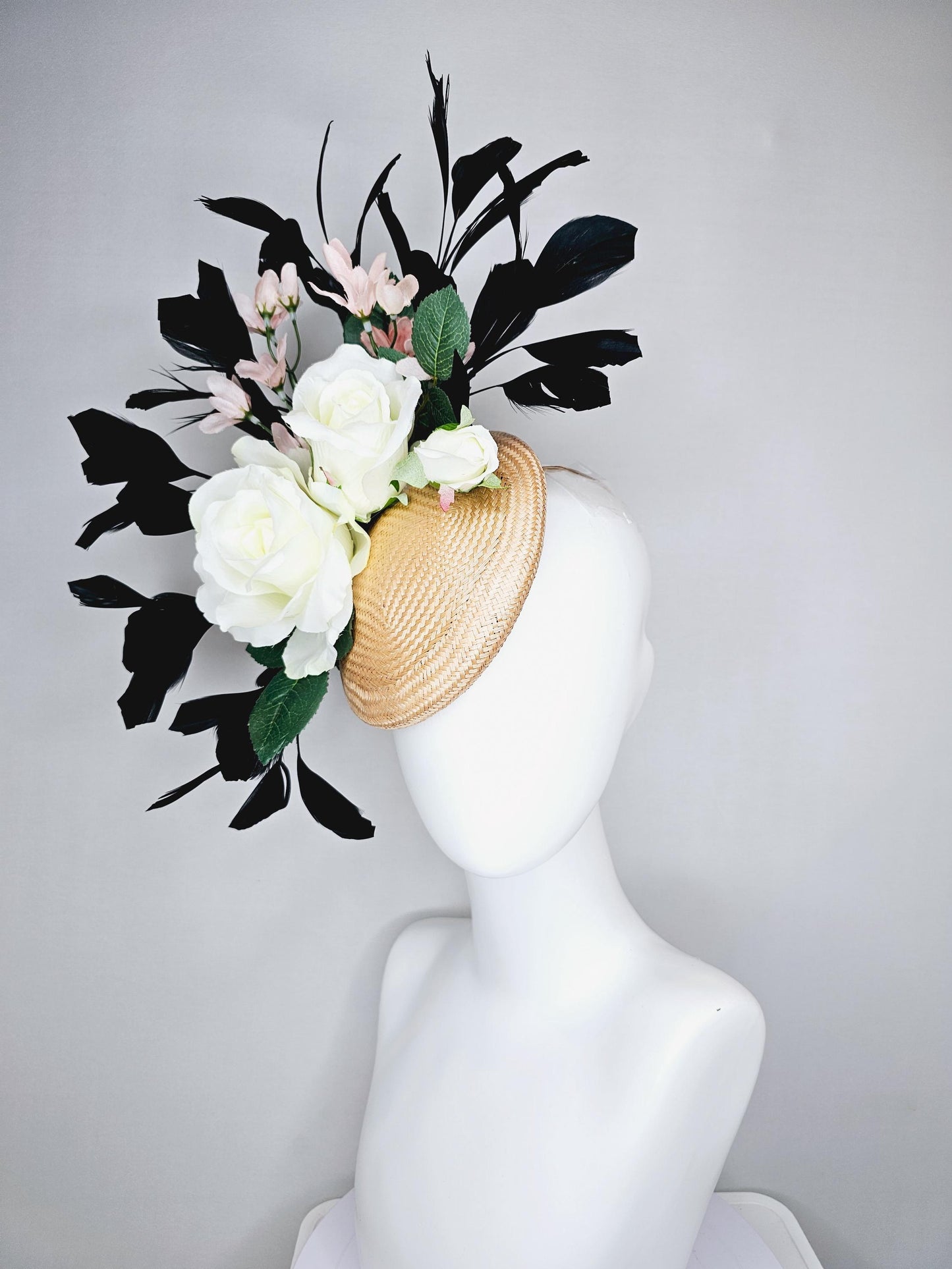 kentucky derby hat fascinator tan straw w/ neutral ivory white satin rose flowers,green leaves, light pink flowers, black branching feathers