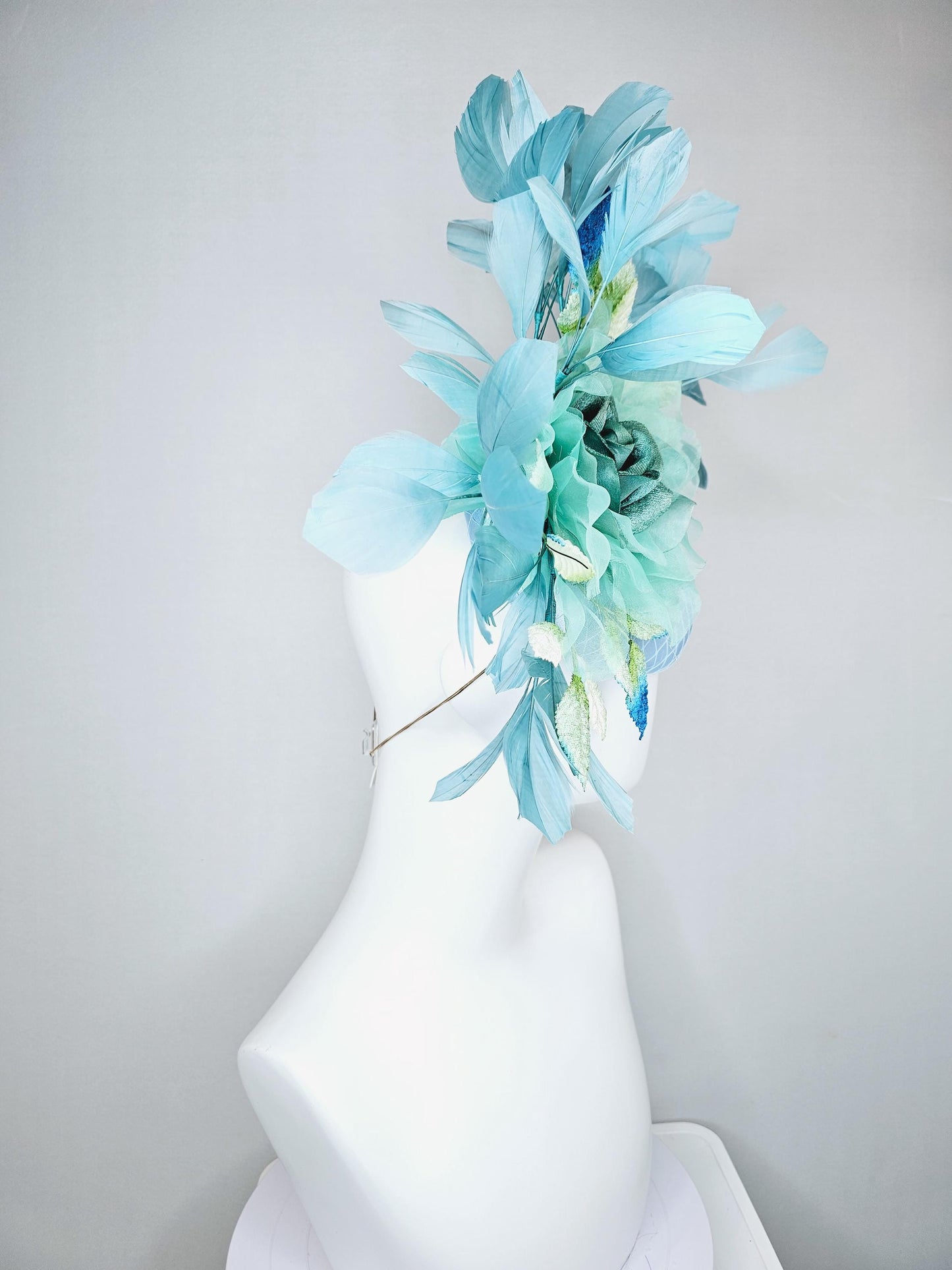 kentucky derby hat fascinator light blue satin with netting green blue organza flower ombre green leaves teal blue branching feathers