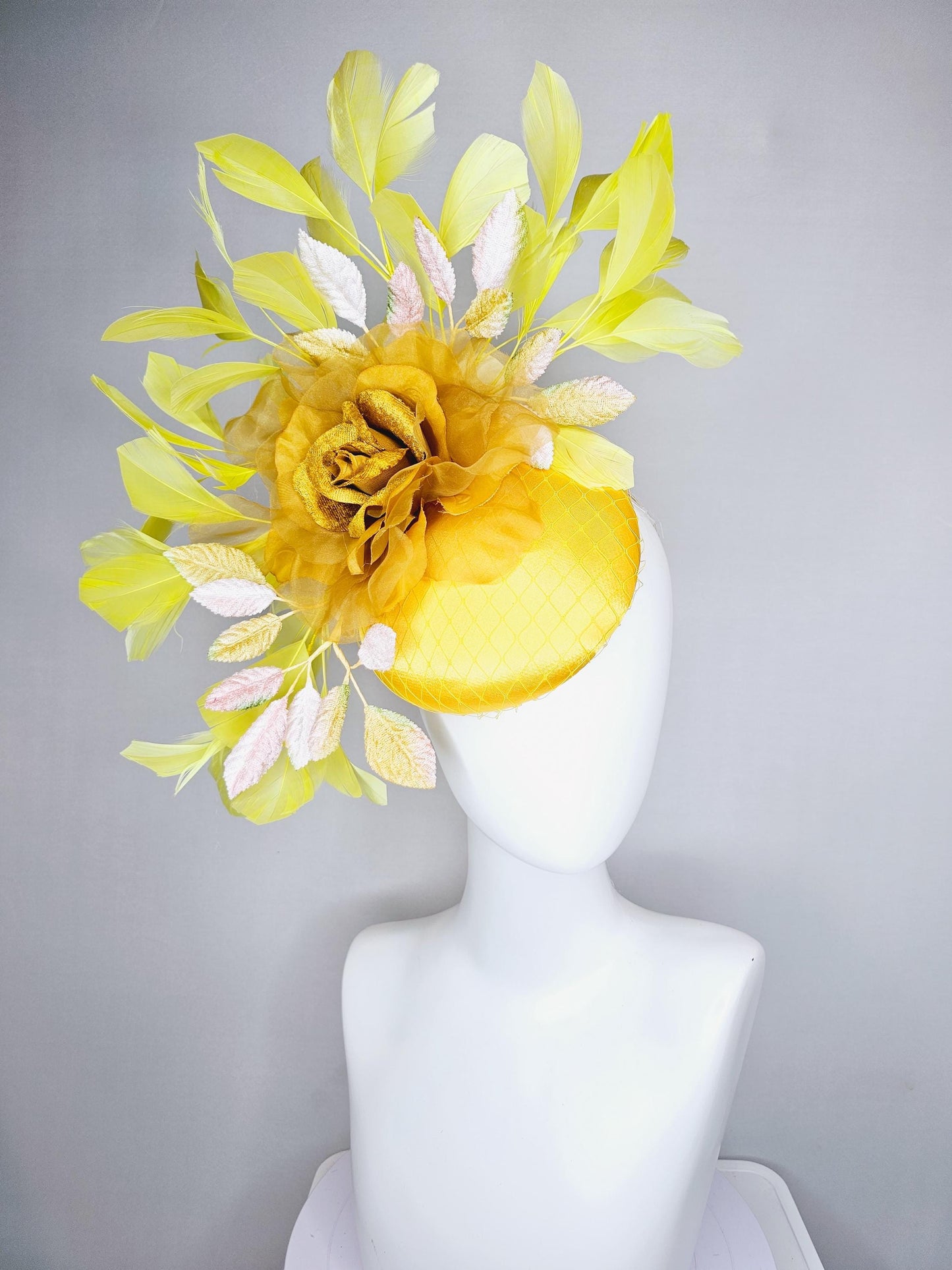 kentucky derby hat fascinator yellow satin with netting, mustard yellow organza flower, light pink yellow leaves, yellow branching feathers