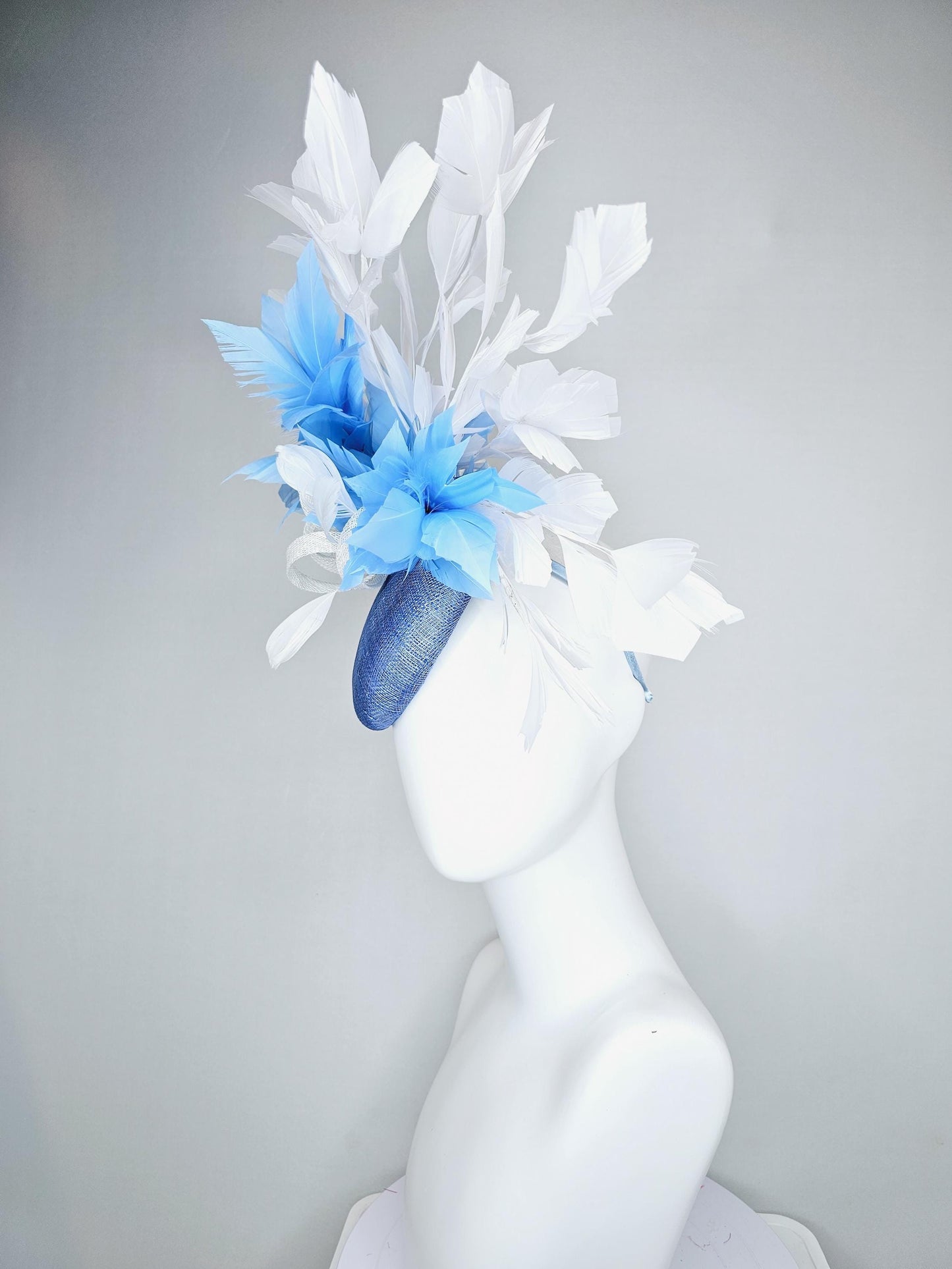 kentucky derby hat fascinator dark blue sinamay base with white sinamay bow, sky blue and white branching feathers