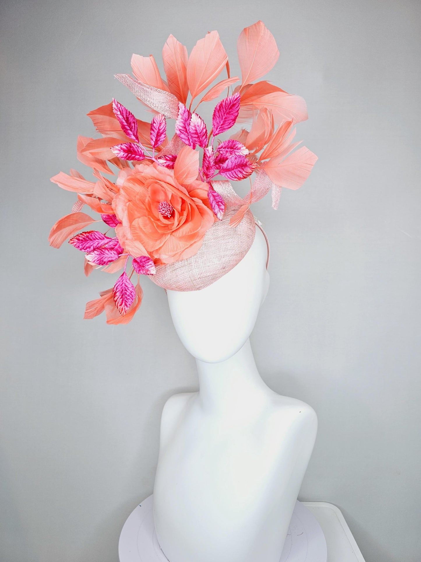 kentucky derby hat fascinator light pink sinamay w/ coral orange peach satin rose flower, bright pink leaves,coral orange branching feathers