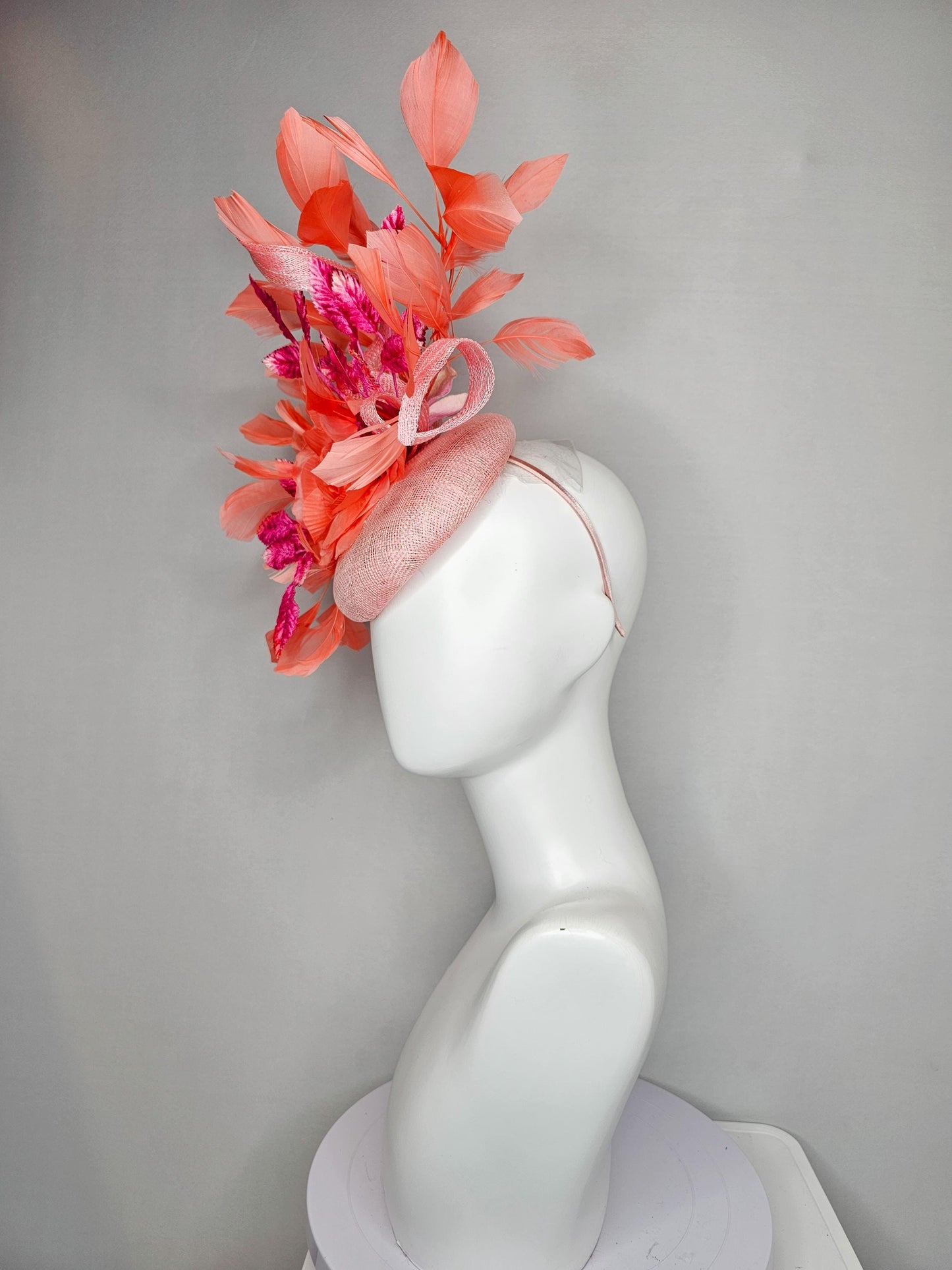 kentucky derby hat fascinator light pink sinamay w/ coral orange peach satin rose flower, bright pink leaves,coral orange branching feathers