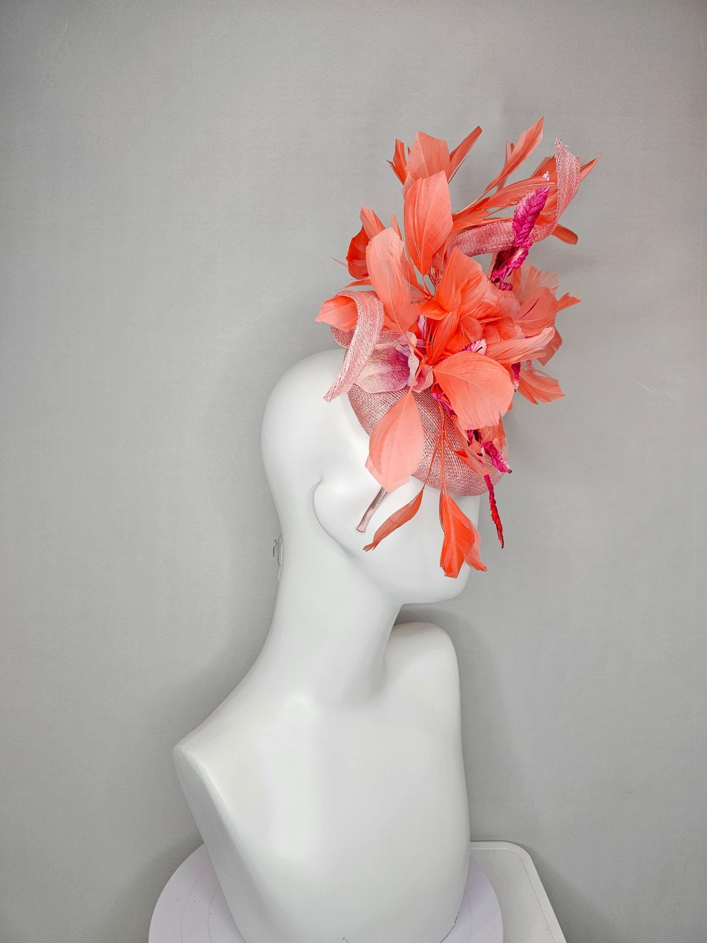 kentucky derby hat fascinator light pink sinamay w/ coral orange peach satin rose flower, bright pink leaves,coral orange branching feathers