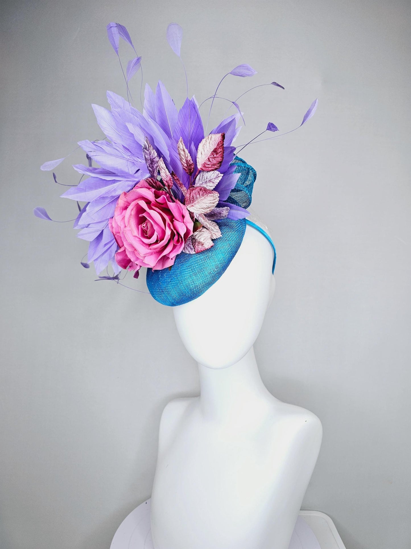 kentucky derby hat fascinator bright blue sinamay,lavender purple branching feathers,pink satin silk rose,pink beige ombre velvet leaves