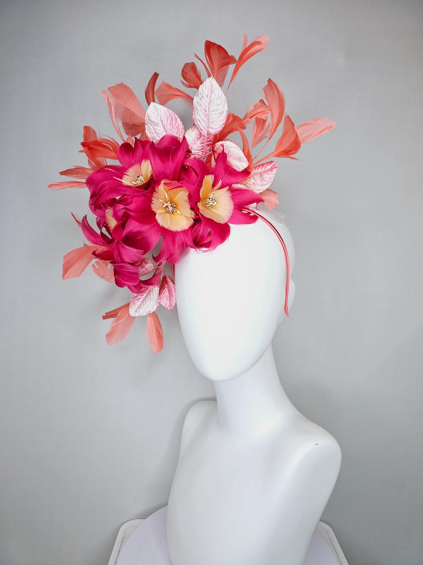 kentucky derby hat fascinator pink feather flowers with light blush pink leaves and coral orange feathers, thin headband