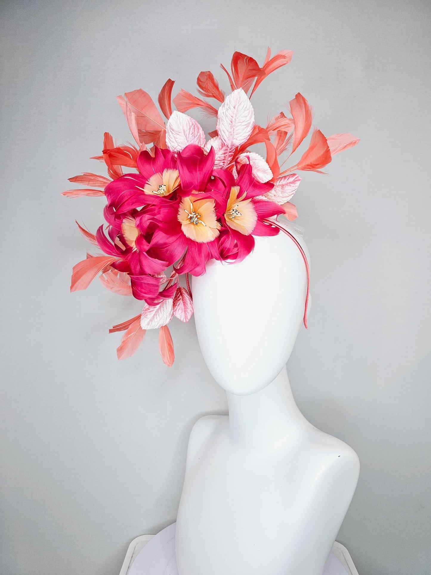kentucky derby hat fascinator pink feather flowers with light blush pink leaves and coral orange feathers, thin headband