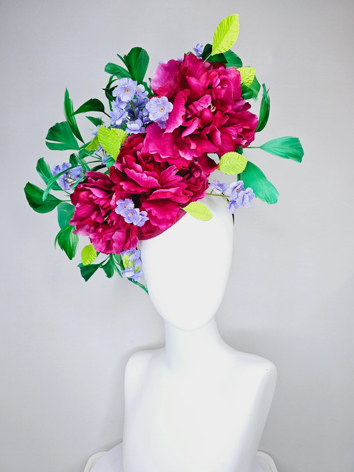 kentucky derby hat fascinator pink sinamay with pink fuchsia satin silk flowers, small light purple flowers,lime green leaves,green feathers
