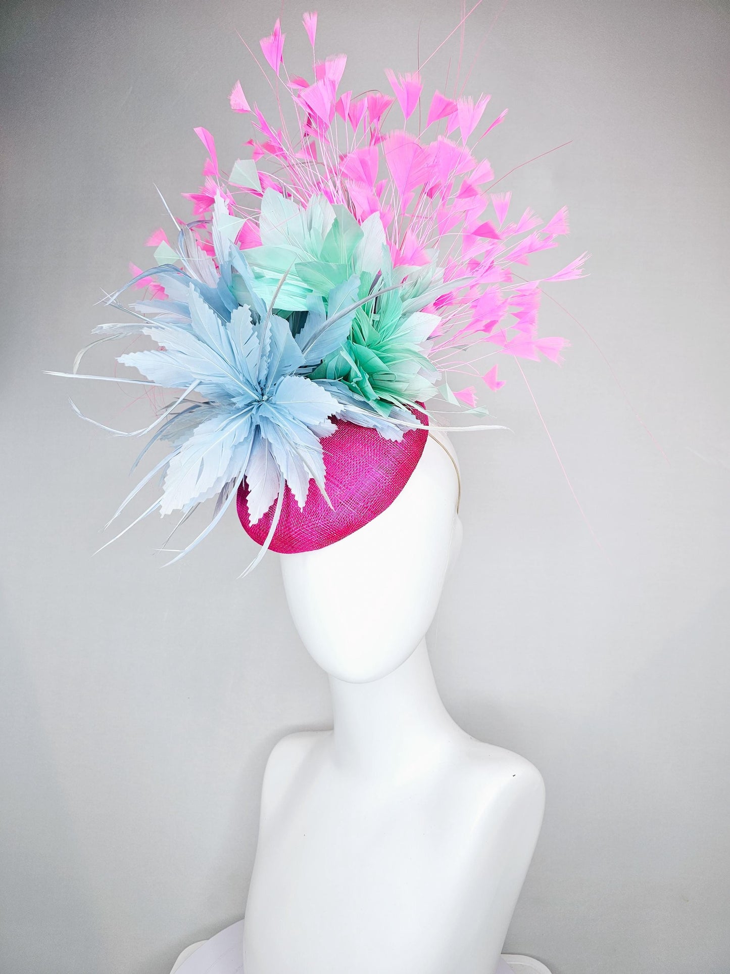 kentucky derby hat fascinator fuchsia pink sinamay with large fluffy light blue aqua blue feather flowers and blush pink branching feathers