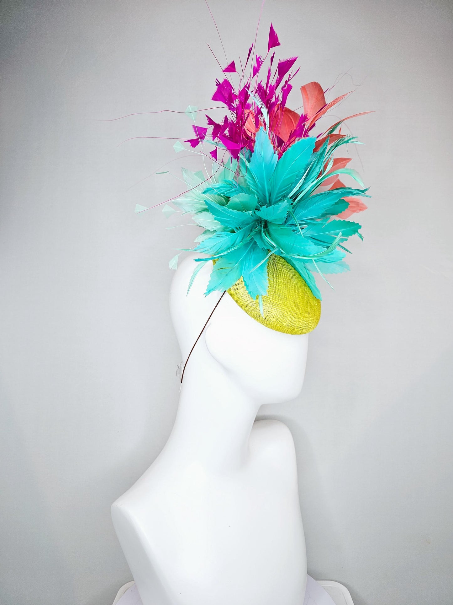 kentucky derby hat fascinator yellow sinamay with large fluffy aqua blue light orange coral feather flowers, bright pink branching feathers
