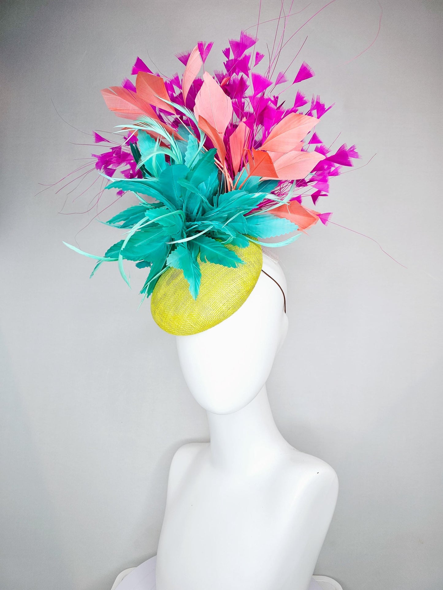 kentucky derby hat fascinator yellow sinamay with large fluffy aqua blue light orange coral feather flowers, bright pink branching feathers