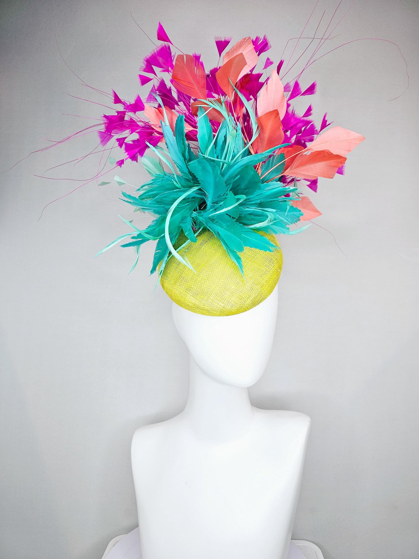 kentucky derby hat fascinator yellow sinamay with large fluffy aqua blue light orange coral feather flowers, bright pink branching feathers