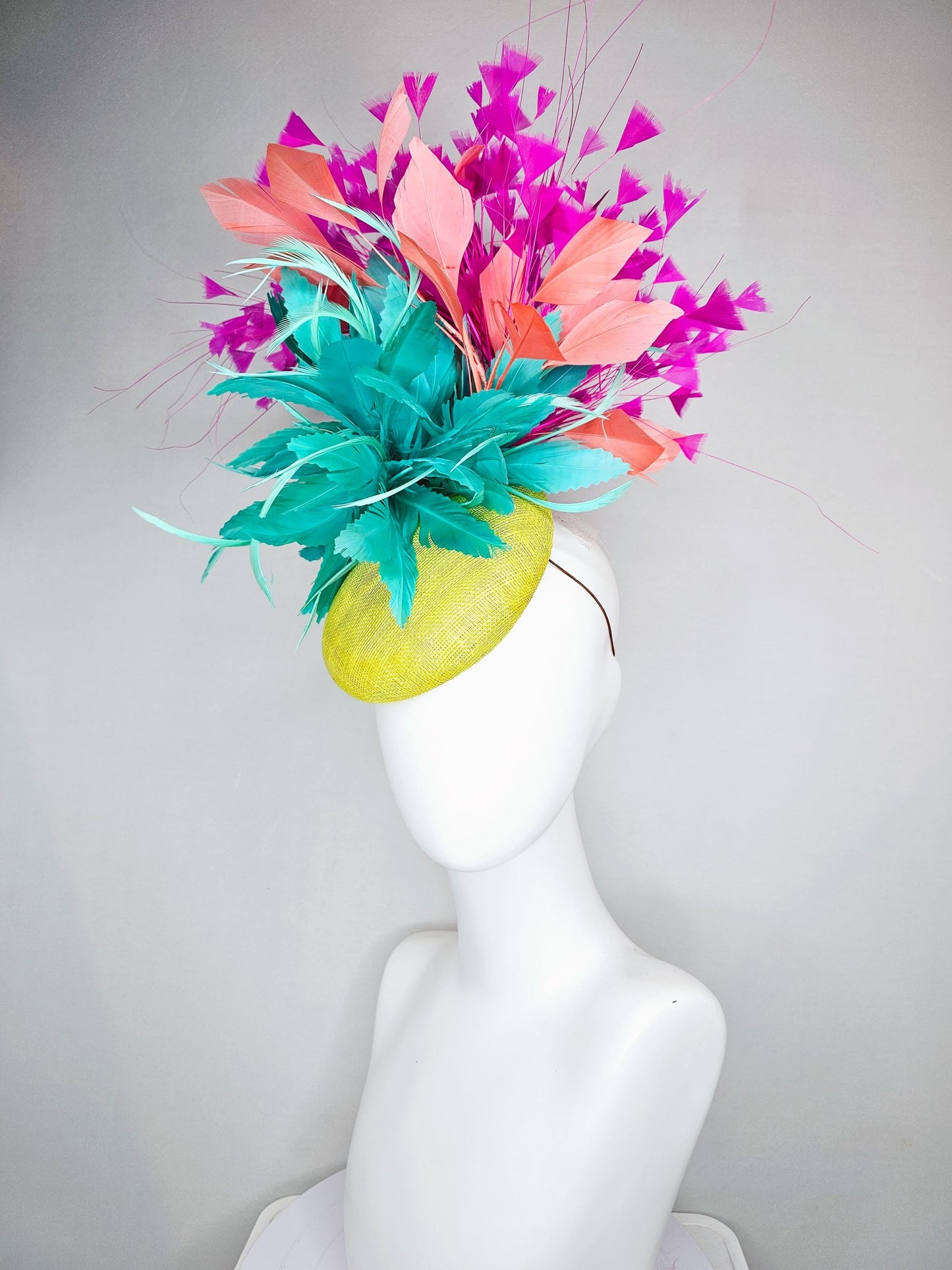 kentucky derby hat fascinator yellow sinamay with large fluffy aqua blue light orange coral feather flowers, bright pink branching feathers