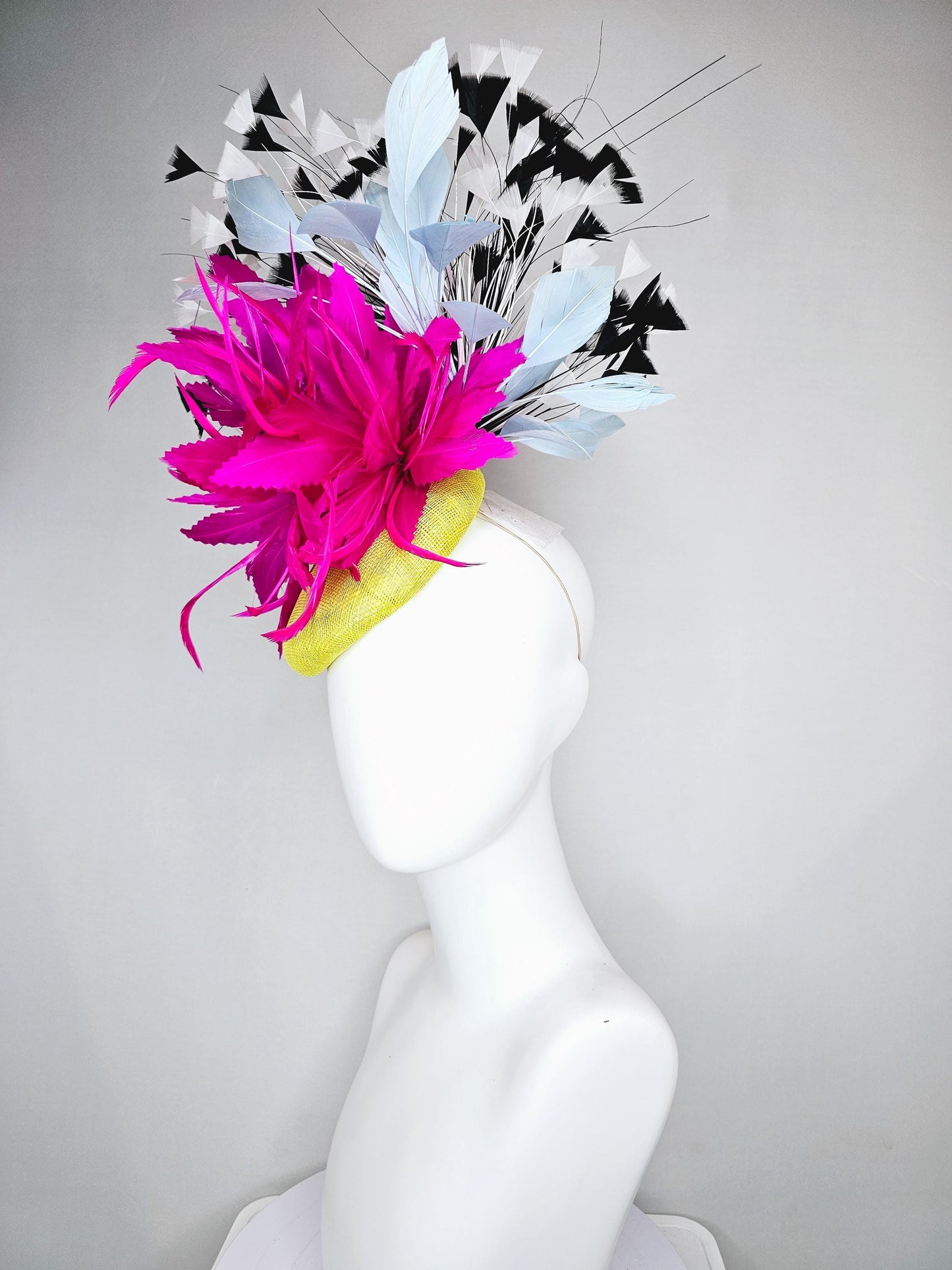 kentucky derby hat fascinator yellow sinamay with large fluffy fuchsia pink light blue feather flowers, black and white branching feathers