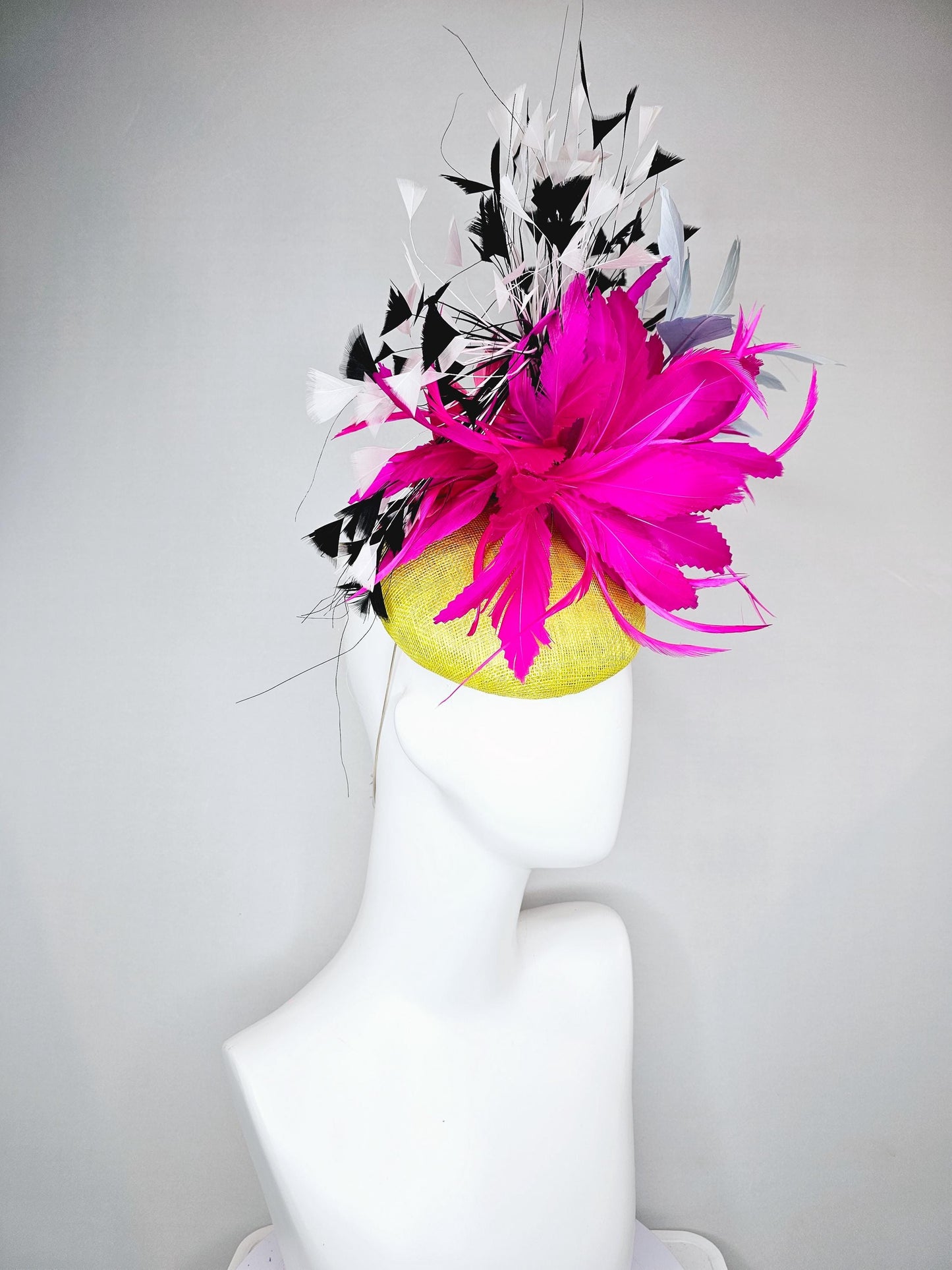 kentucky derby hat fascinator yellow sinamay with large fluffy fuchsia pink light blue feather flowers, black and white branching feathers