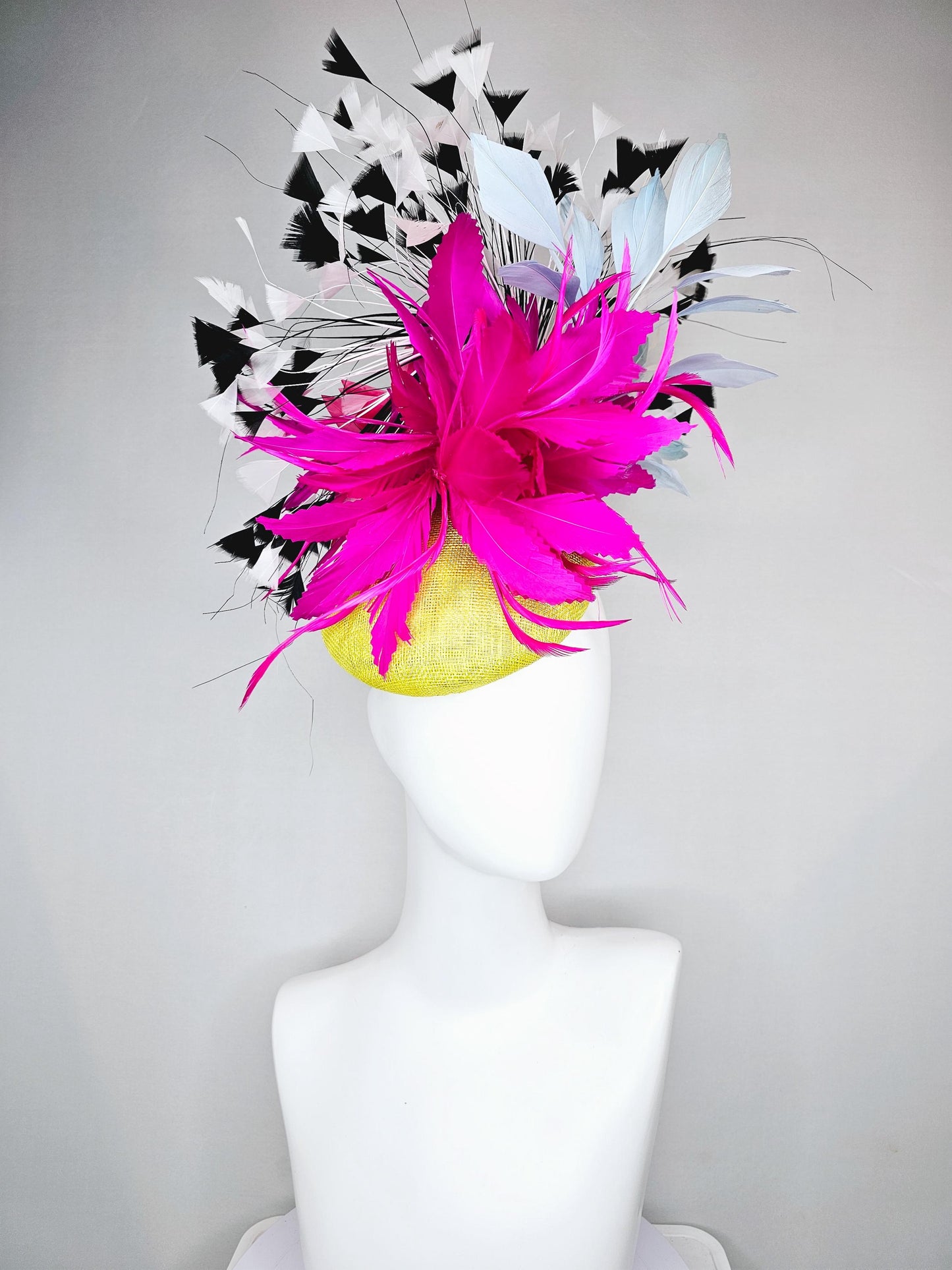 kentucky derby hat fascinator yellow sinamay with large fluffy fuchsia pink light blue feather flowers, black and white branching feathers