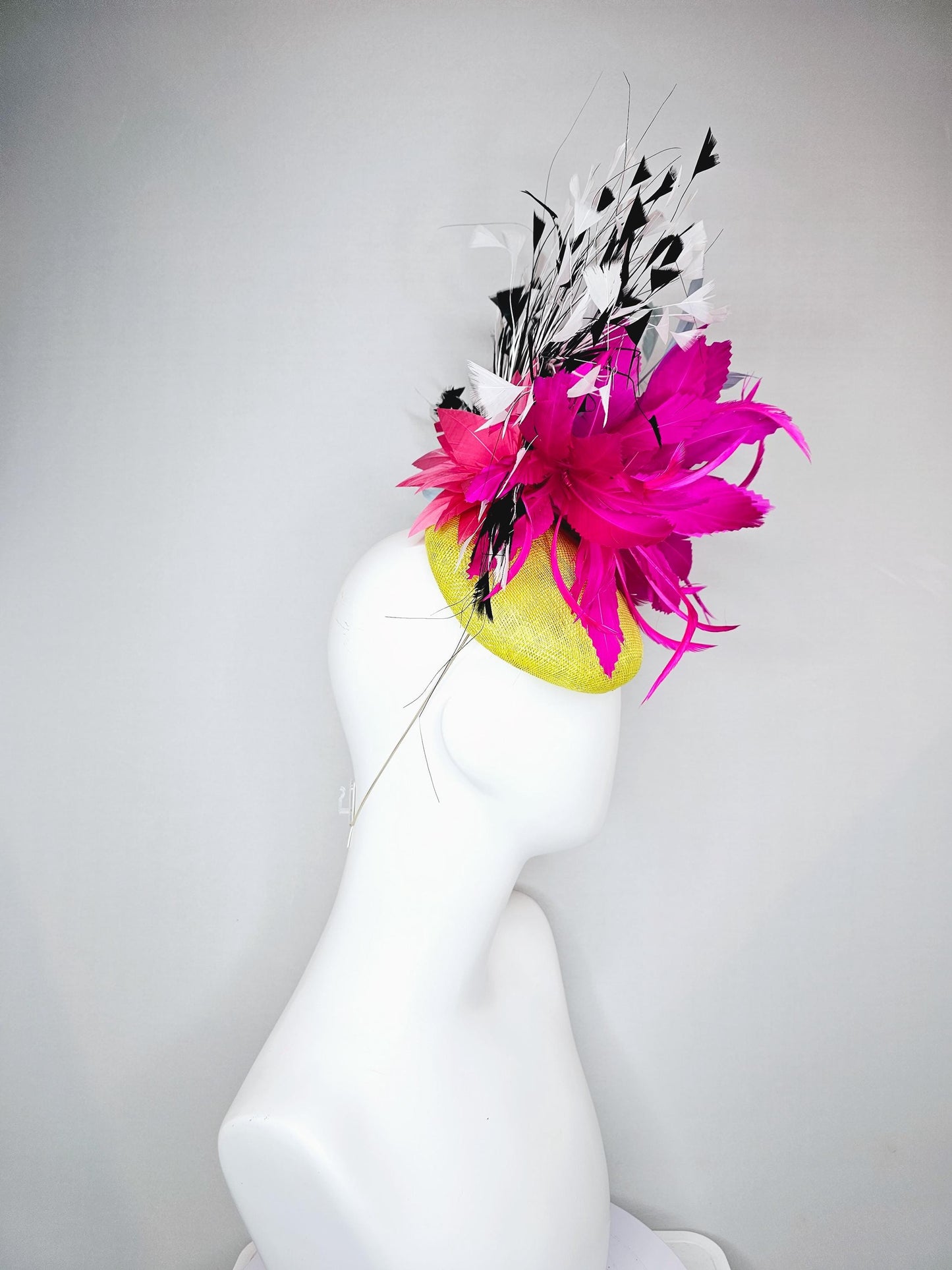 kentucky derby hat fascinator yellow sinamay with large fluffy fuchsia pink light blue feather flowers, black and white branching feathers