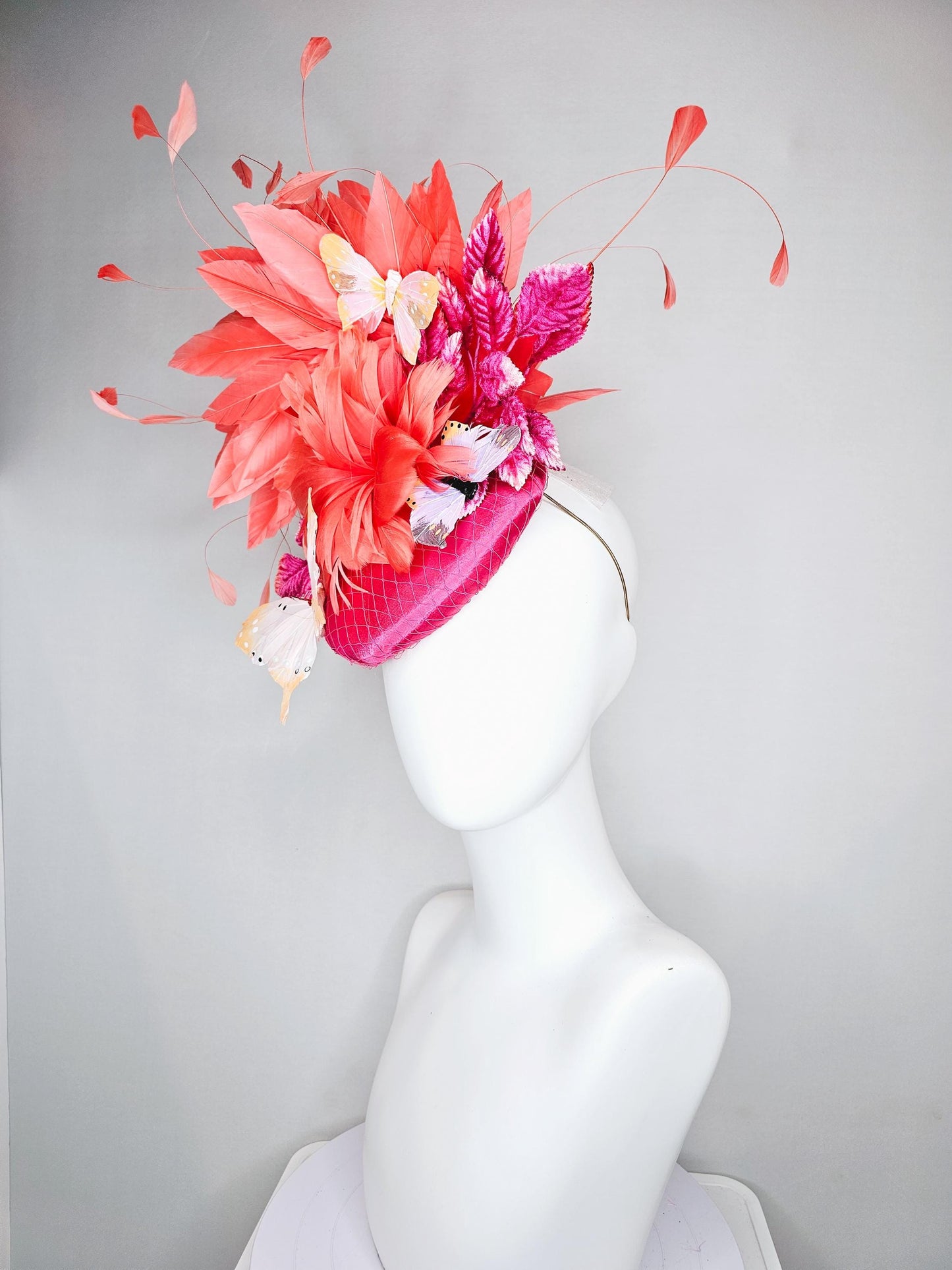 kentucky derby hat fascinator pink satin with netting,orange coral feather flower,pink leaves,orange branching feathers,white butterflies