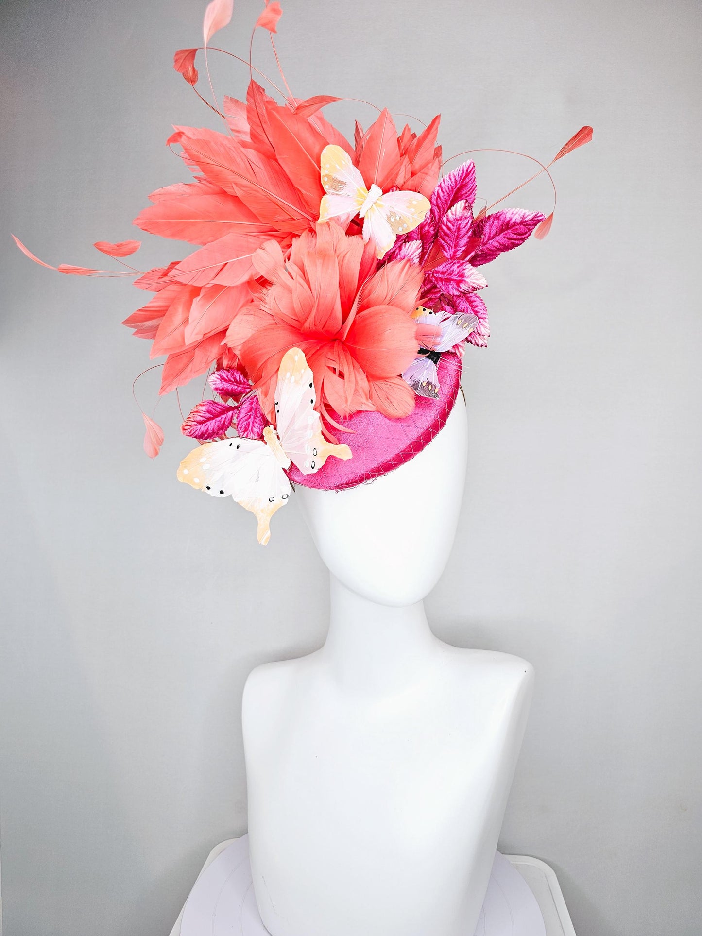 kentucky derby hat fascinator pink satin with netting,orange coral feather flower,pink leaves,orange branching feathers,white butterflies