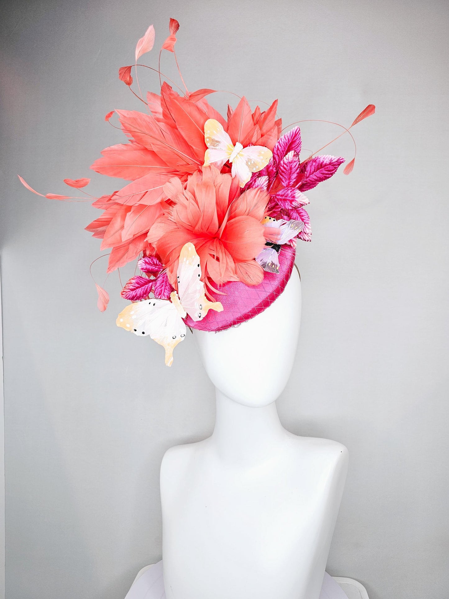 kentucky derby hat fascinator pink satin with netting orange coral feather flower pink leaves orange branching feathers blush butterflies