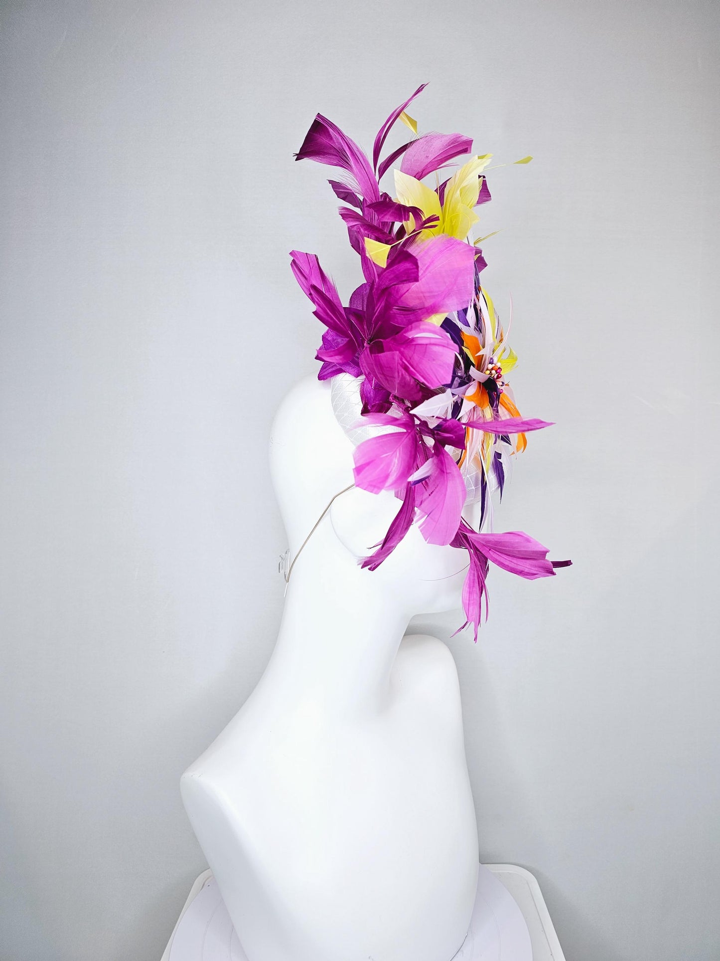 kentucky derby hat fascinator white satin with netting, orange yellow white purple feather flower, yellow purple magenta branching feathers