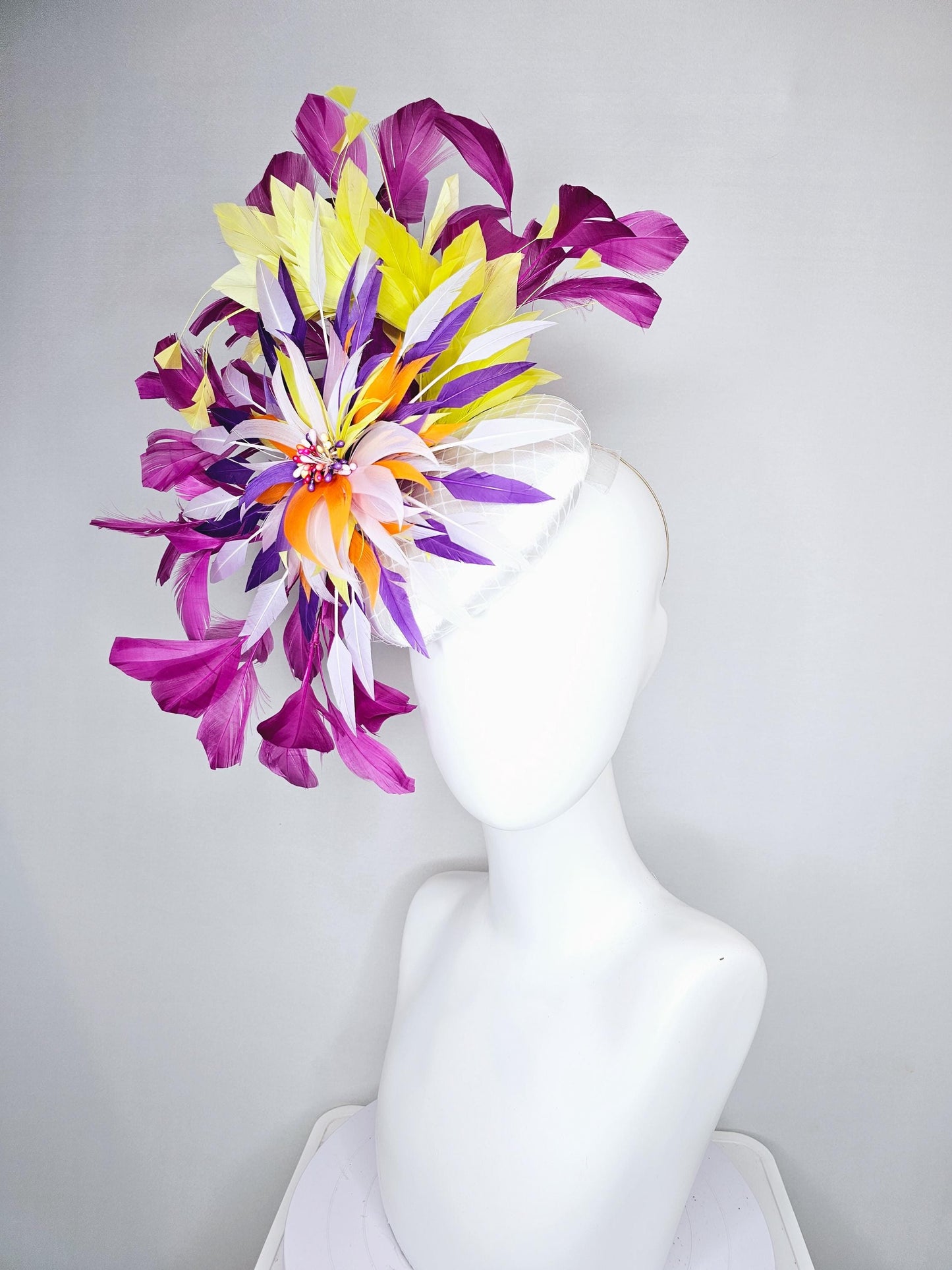 kentucky derby hat fascinator white satin with netting, orange yellow white purple feather flower, yellow purple magenta branching feathers