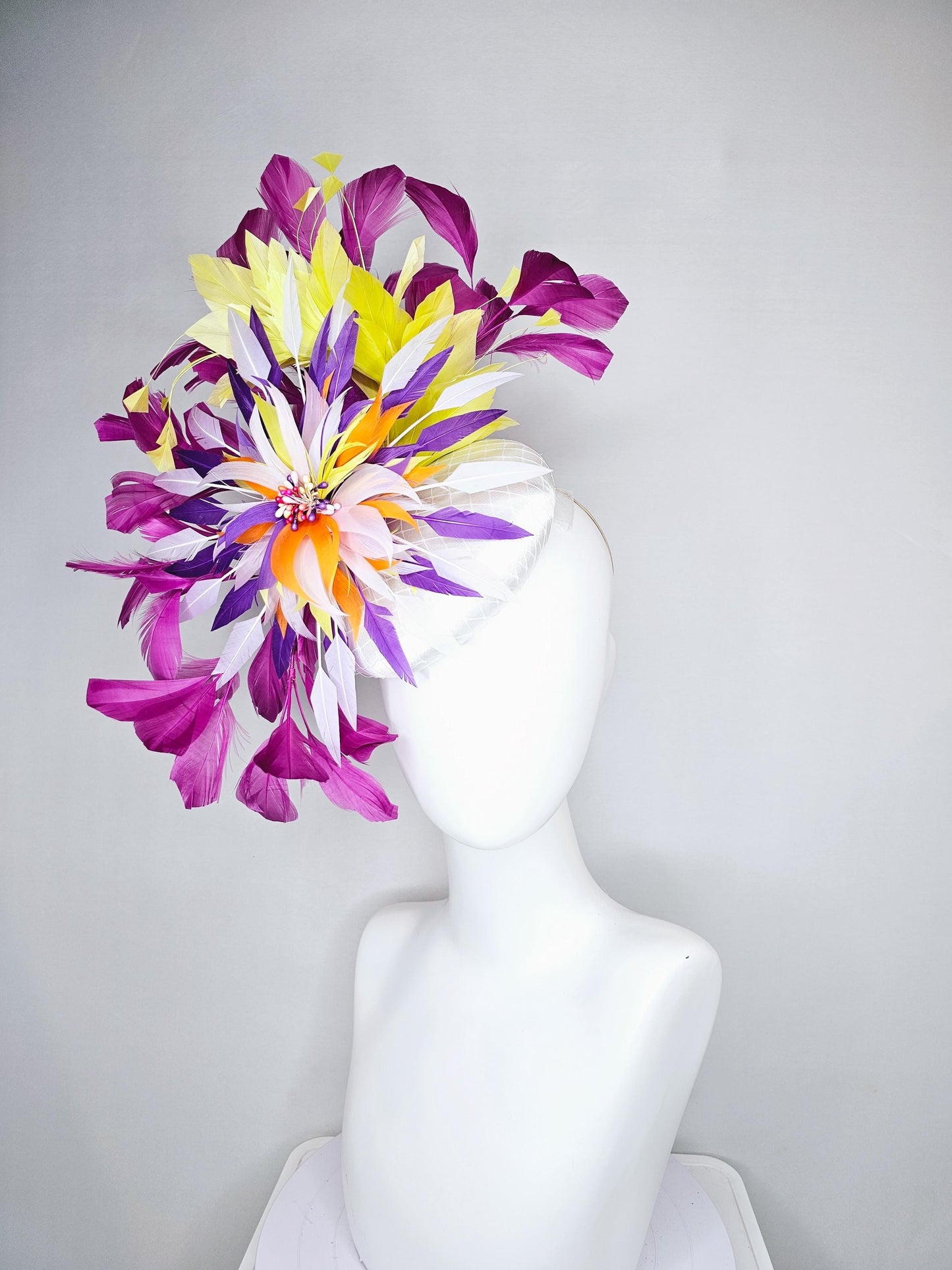 kentucky derby hat fascinator white satin with netting, orange yellow white purple feather flower, yellow purple magenta branching feathers