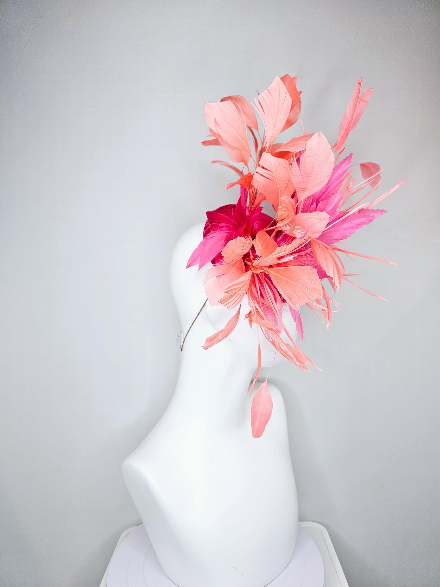 kentucky derby hat fascinator hot pink satin with netting,and light pink feather flowers with coral orange peach branching feathers