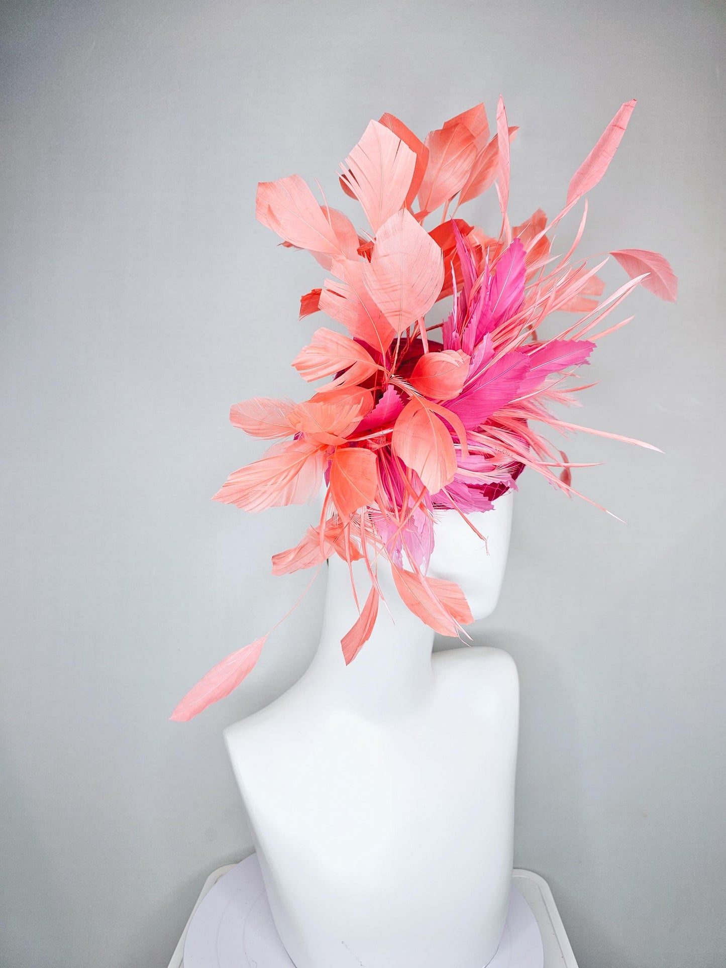 kentucky derby hat fascinator hot pink satin with netting,and light pink feather flowers with coral orange peach branching feathers